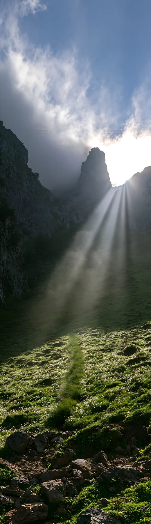 Sunrays shining through Picos de Europa mountain peaks - AI-generated stock image