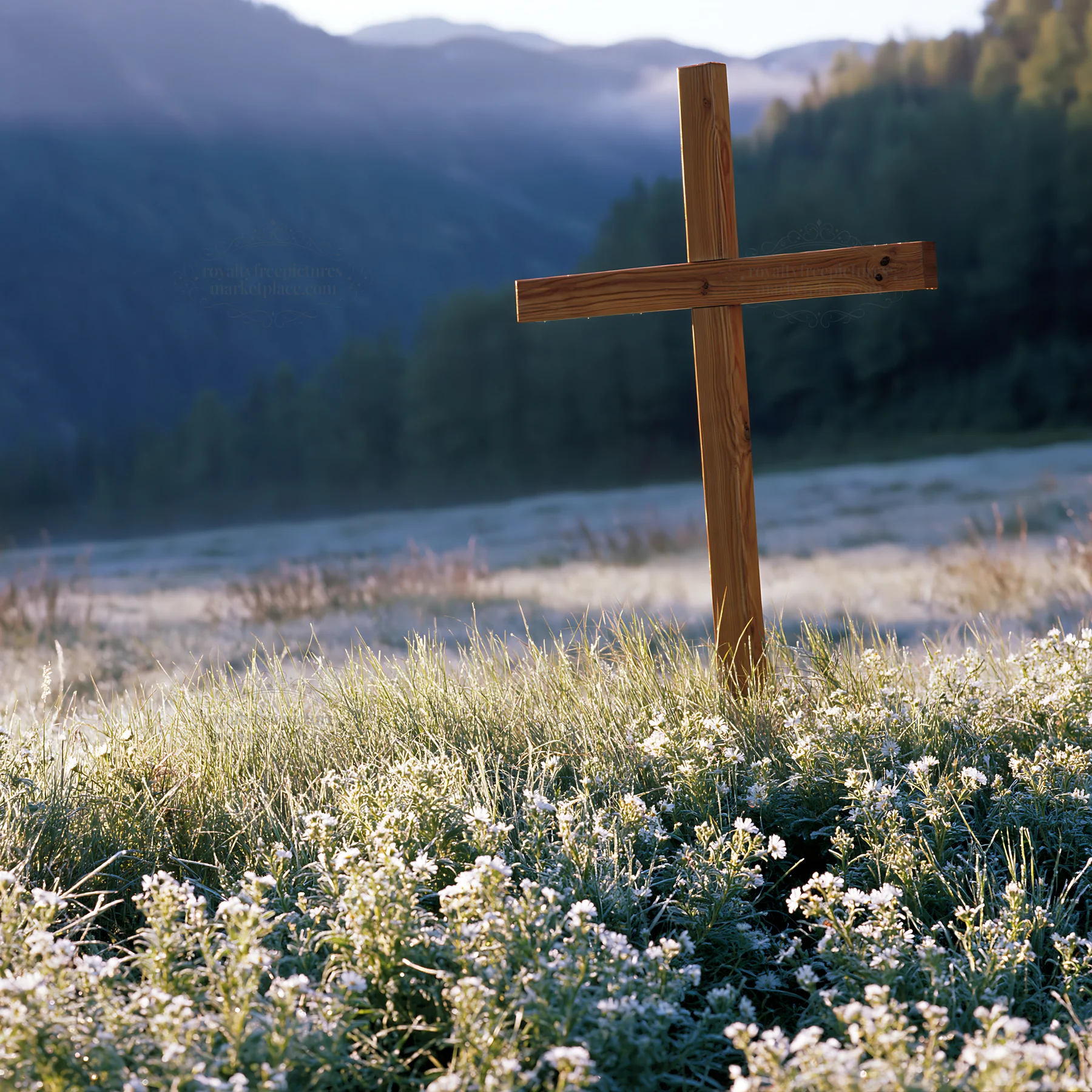 Wooden Christian cross in mountain meadow at dawn - AI-generated stock image