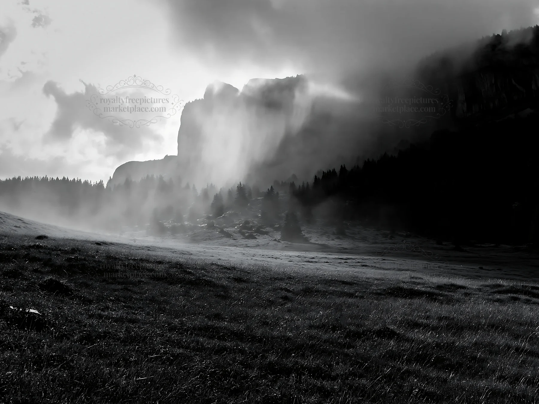 Meadow beneath crags with mist and cloudy sky - AI-generated stock image
