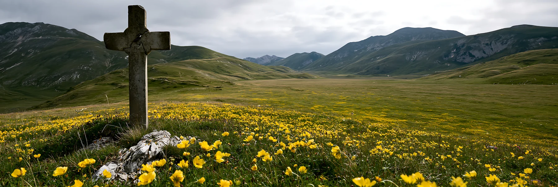 Christian cross in meadow with yellow flowers near mountains - AI-generated stock image