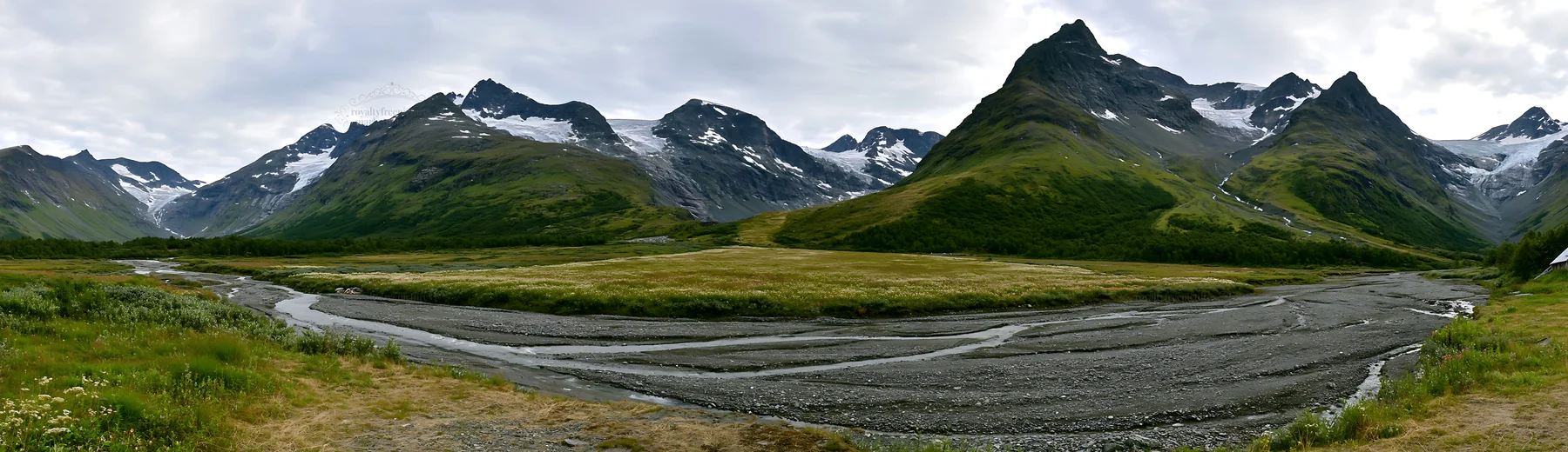 Regenerative meadow with mountains and river in Norway - AI-generated stock image