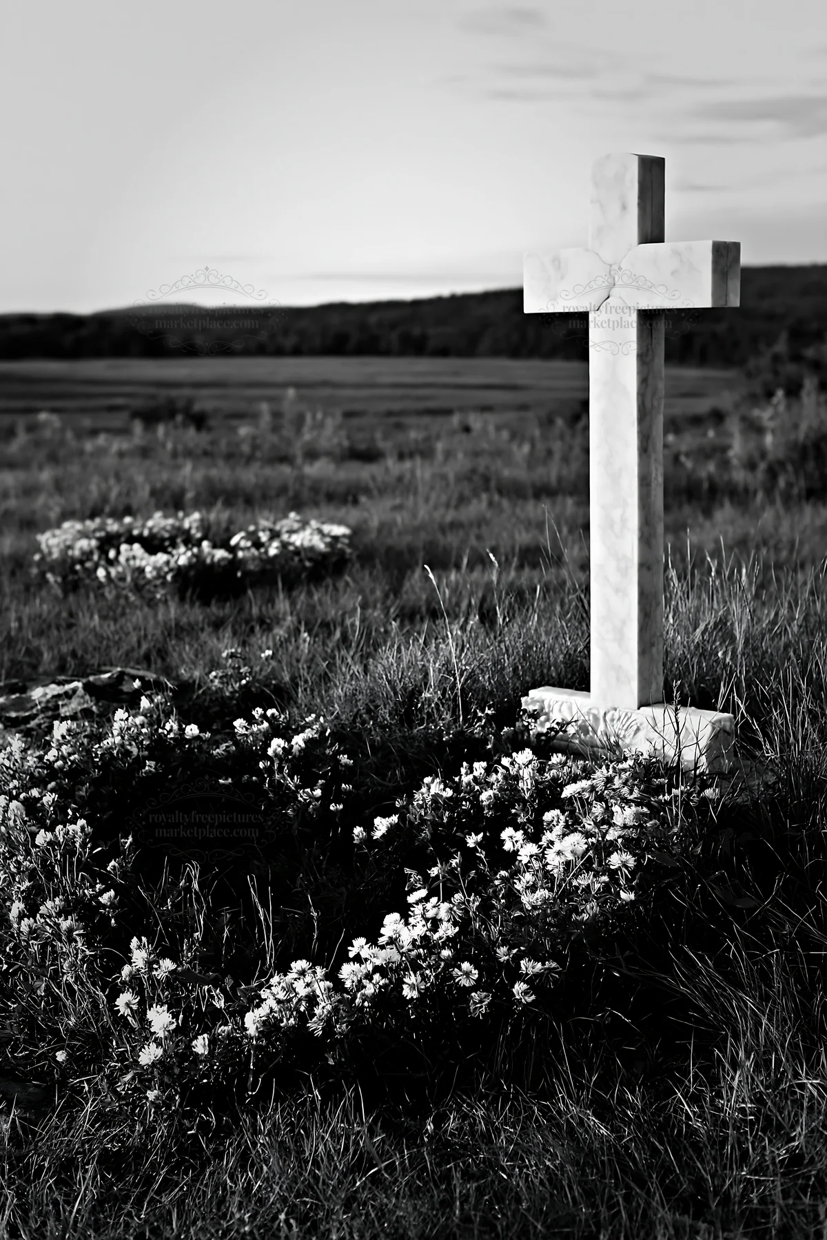 Simple Christian cross in meadow with flowers near sunset - AI-generated stock image