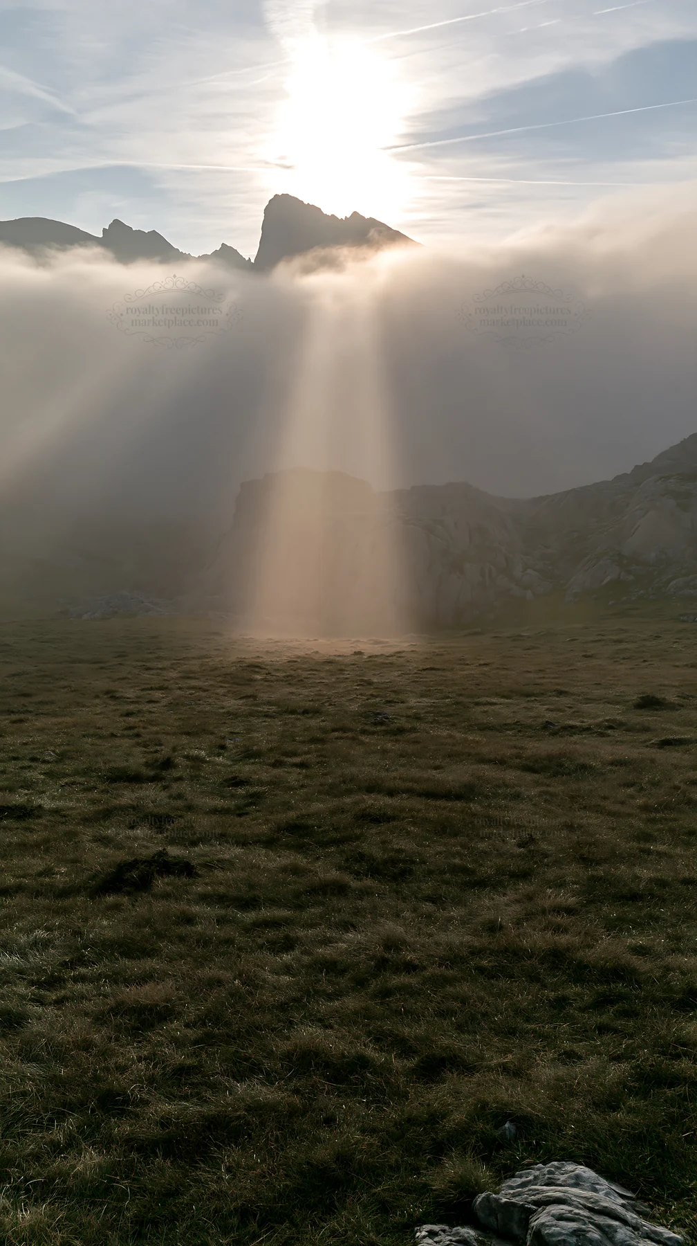 Sunrays shining on Picos de Europa meadow - AI-generated stock image