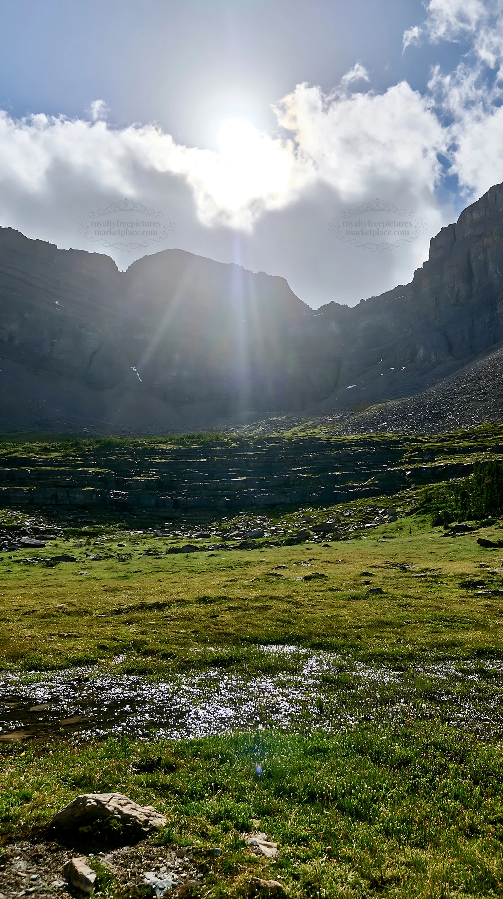 Light rays shine on Sunshine Meadows in Banff National Park - AI-generated stock image