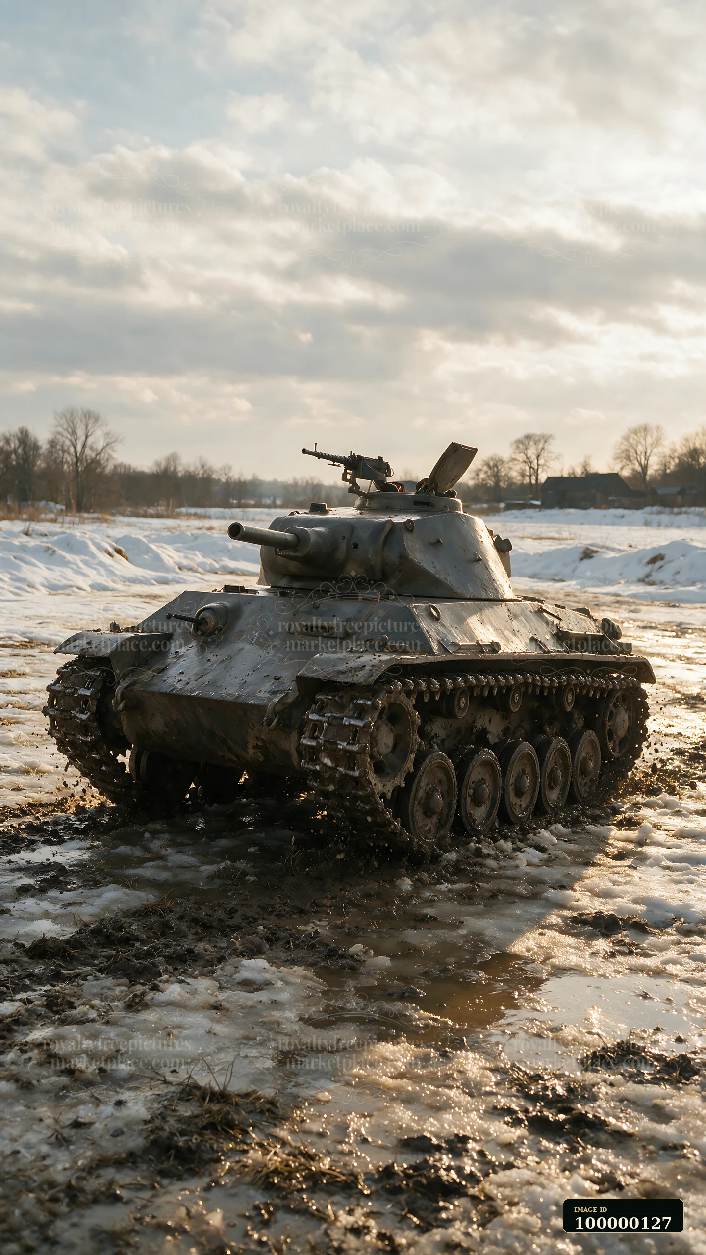 Panzer tank sits on muddy, partially thawed ground in a snowy rural field beneath a cloudy winter sky.