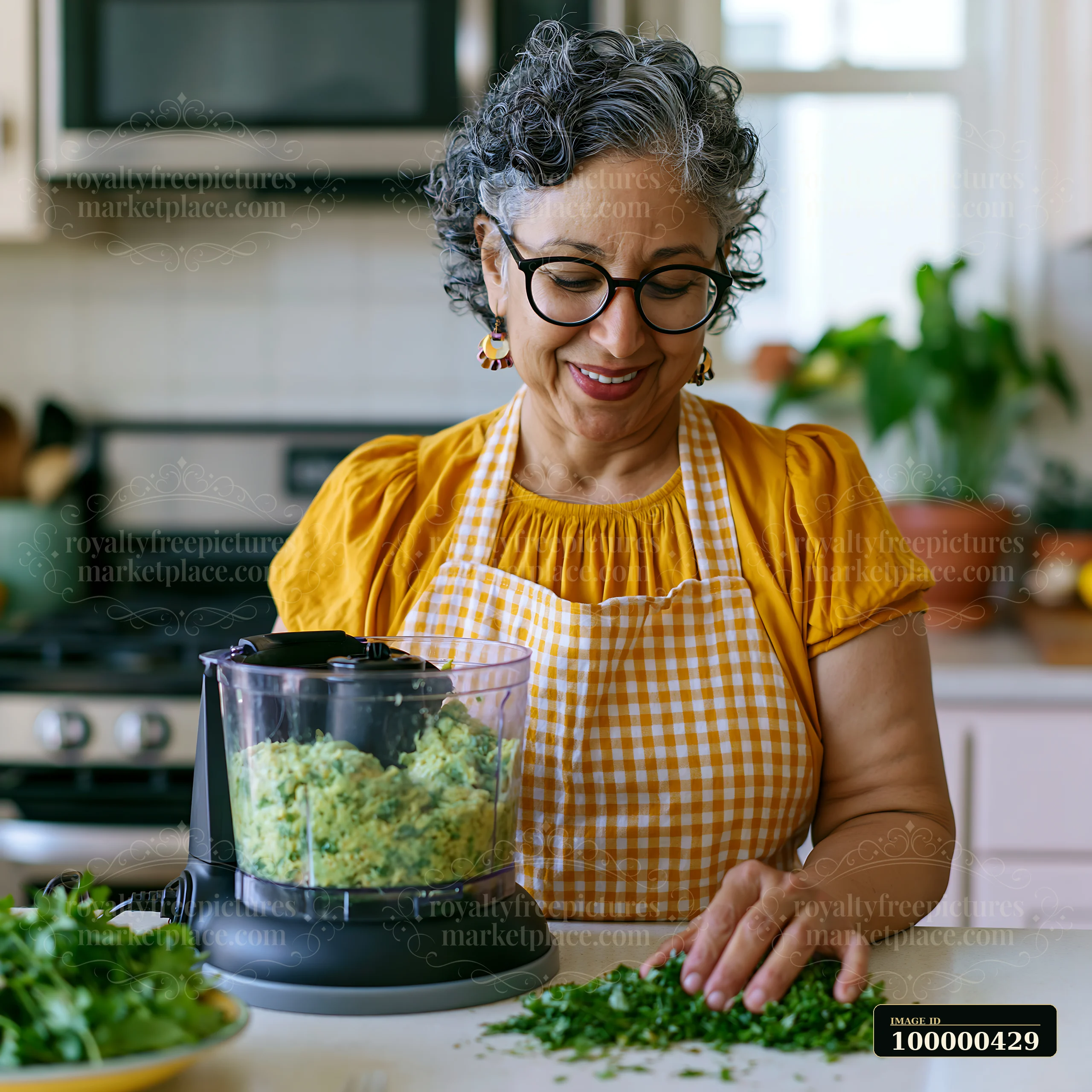 A person uses adaptive kitchen tools while preparing food in a bright kitchen.
