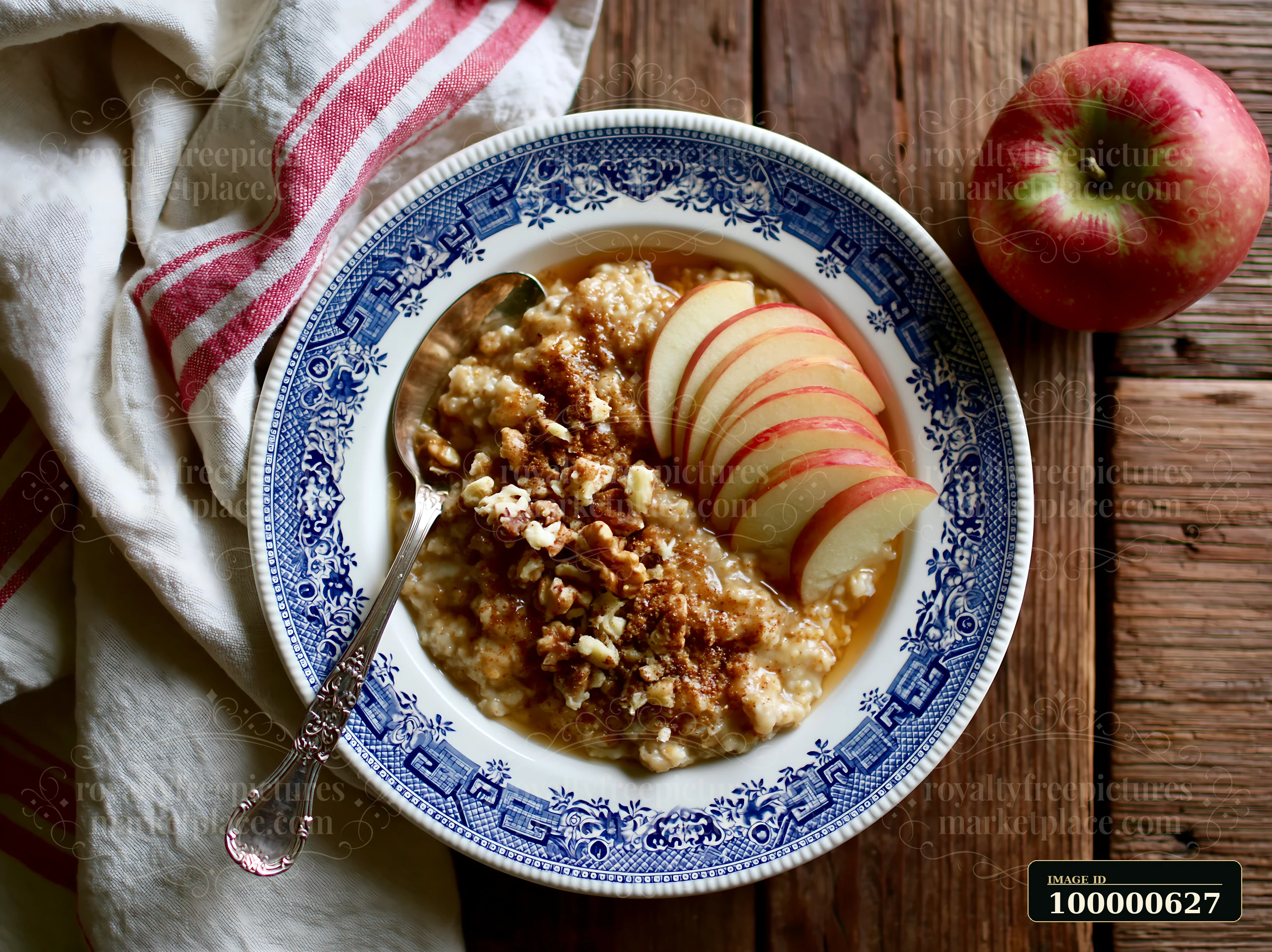 This bowl features oatmeal topped with sliced apples, nuts, and a sprinkle of brown sugar.