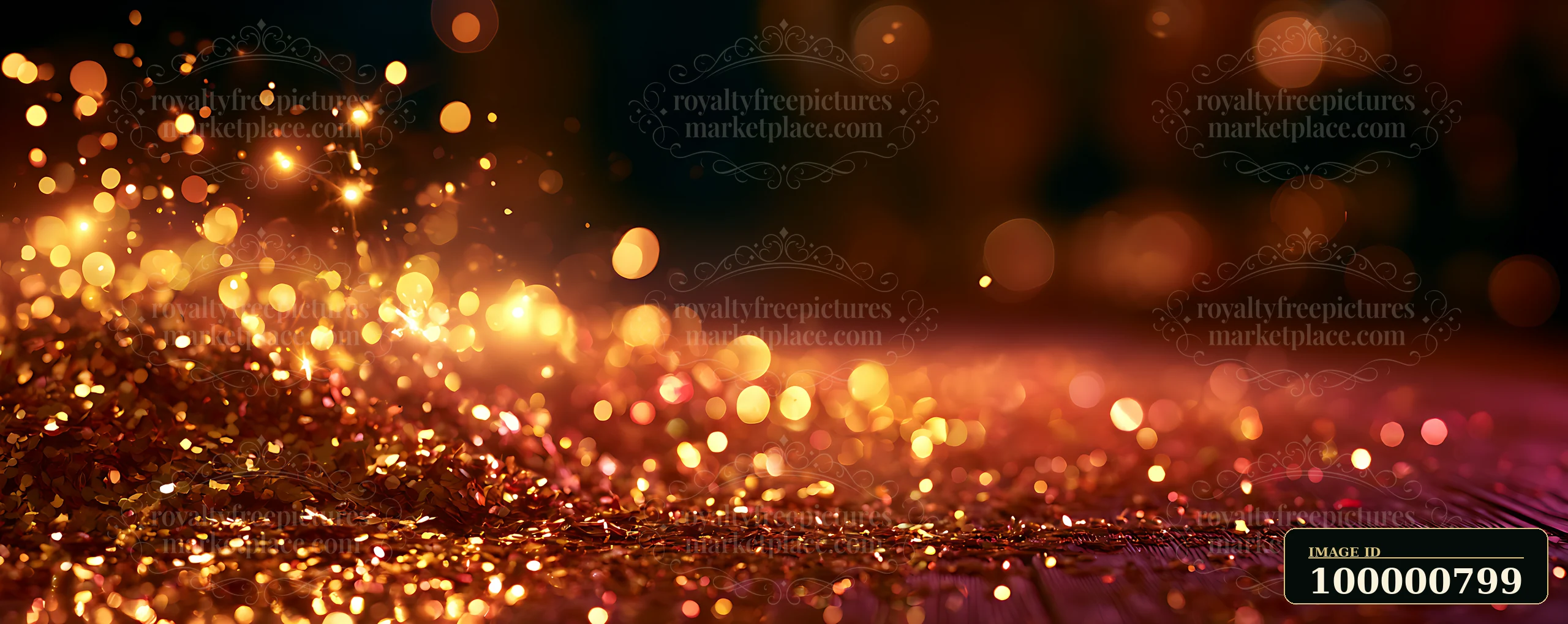 Gold glitter is scattered across the surface, catching light and creating a vibrant background.