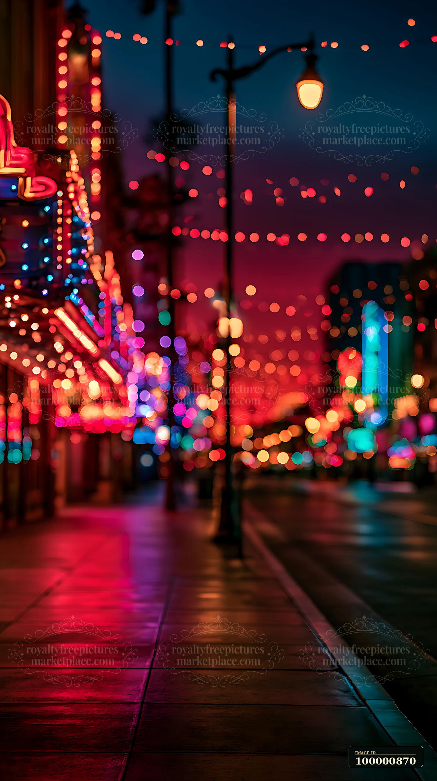 A city street features vibrant lights and decorative signage during the night.