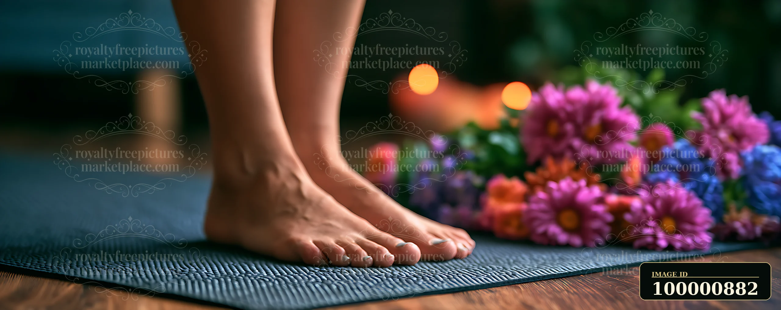 Bare feet stand on a textured yoga mat surrounded by vibrant flowers in a cozy indoor setting.