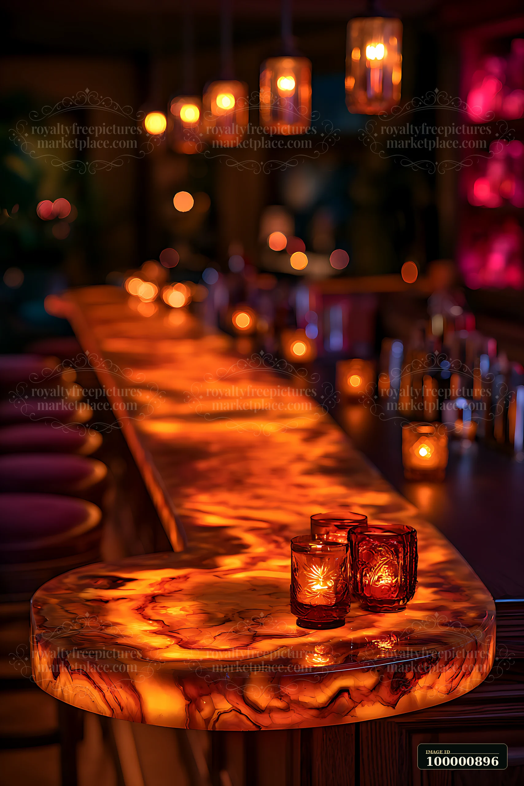 A bar top made of glowing material is illuminated by candles and hanging lights.