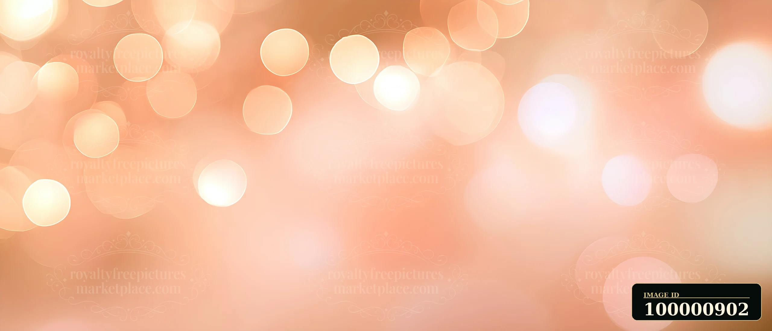 This scene features an abstract background filled with soft bokeh lights in warm tones.