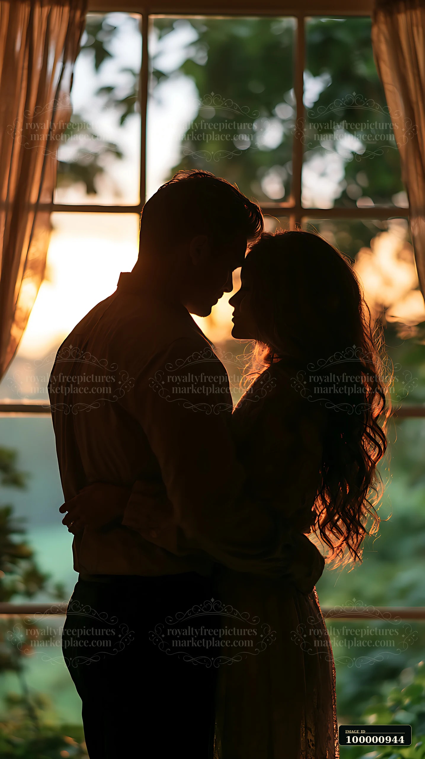 A couple stands close together, silhouetted against a window with sunlight streaming through.