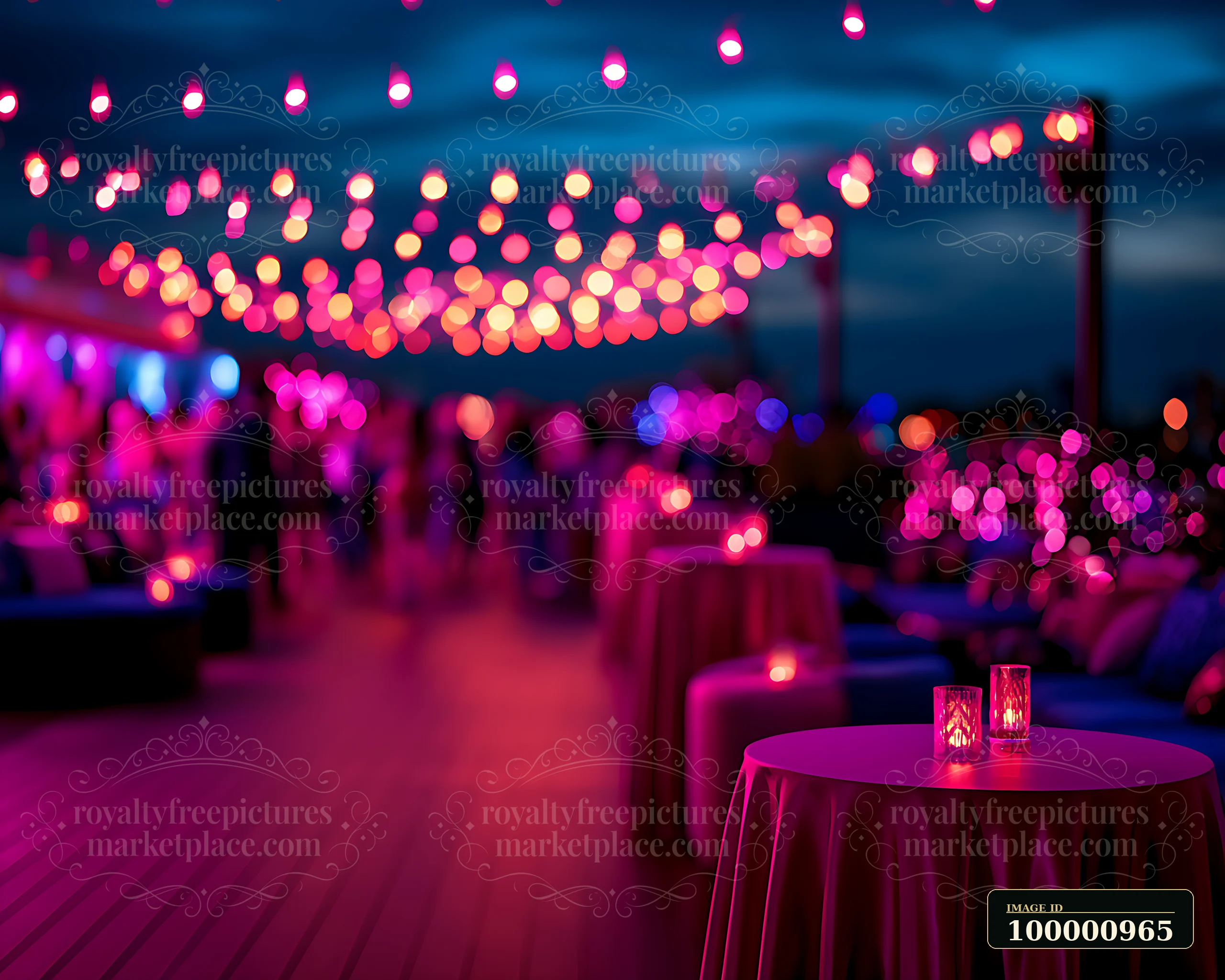 A rooftop party features tables adorned with glowing candles under colorful string lights at dusk.