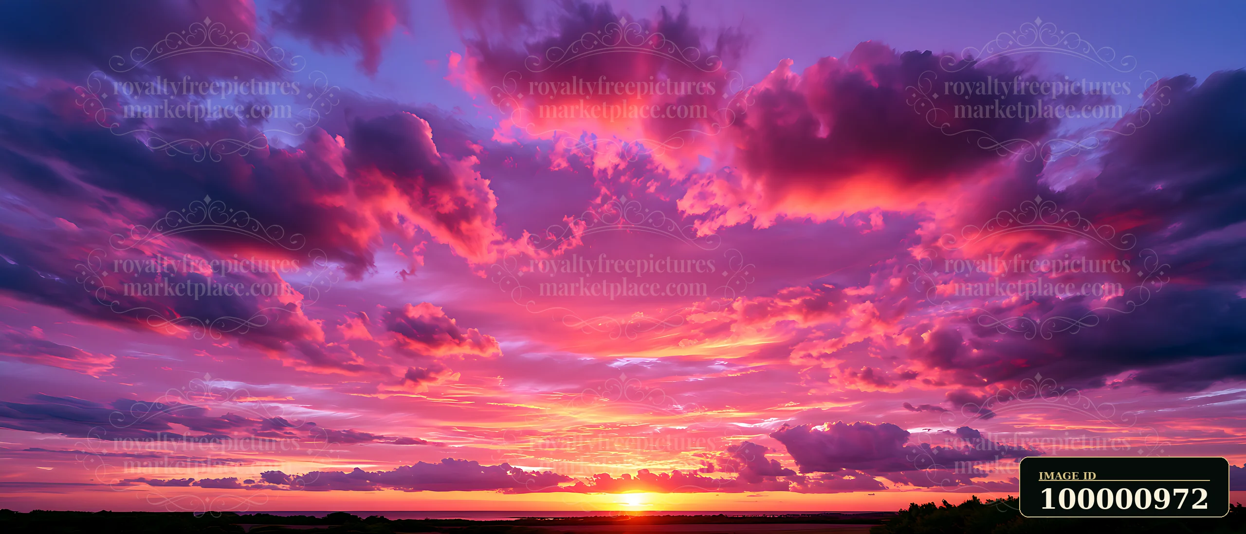 A sunset fills the sky with shades of purple, pink, and orange as clouds reflect the fading sunlight.