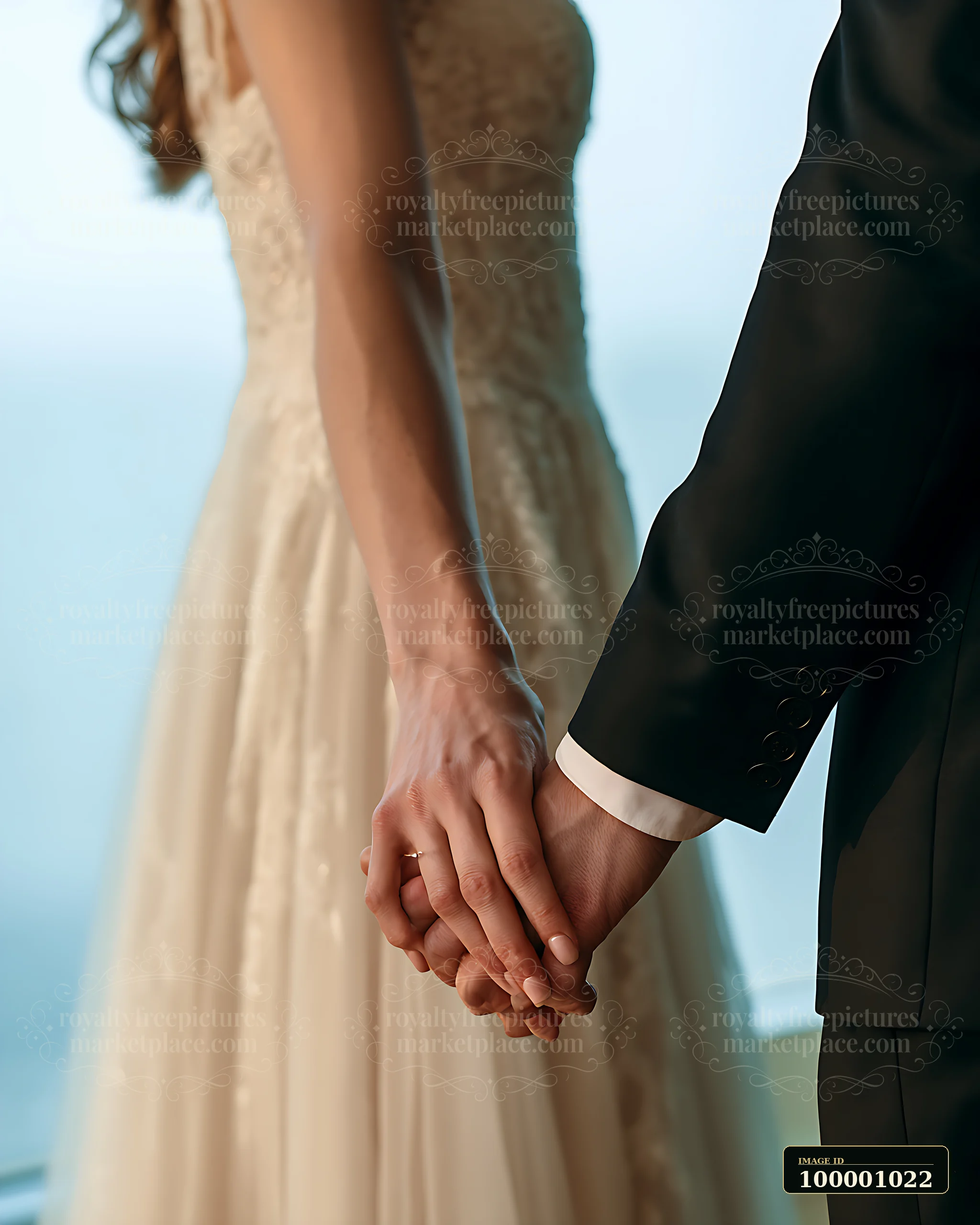 A couple stands side by side holding hands.