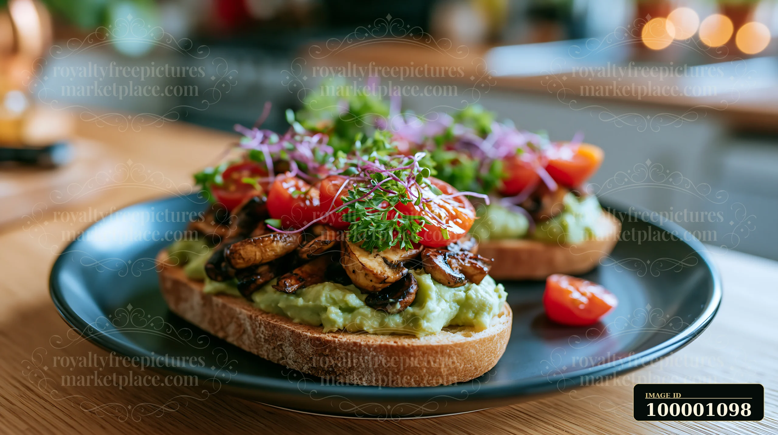 A breakfast plate features avocado toast topped with grilled mushrooms, cherry tomatoes, and sprouts on a wooden table in a cozy kitchen setting.