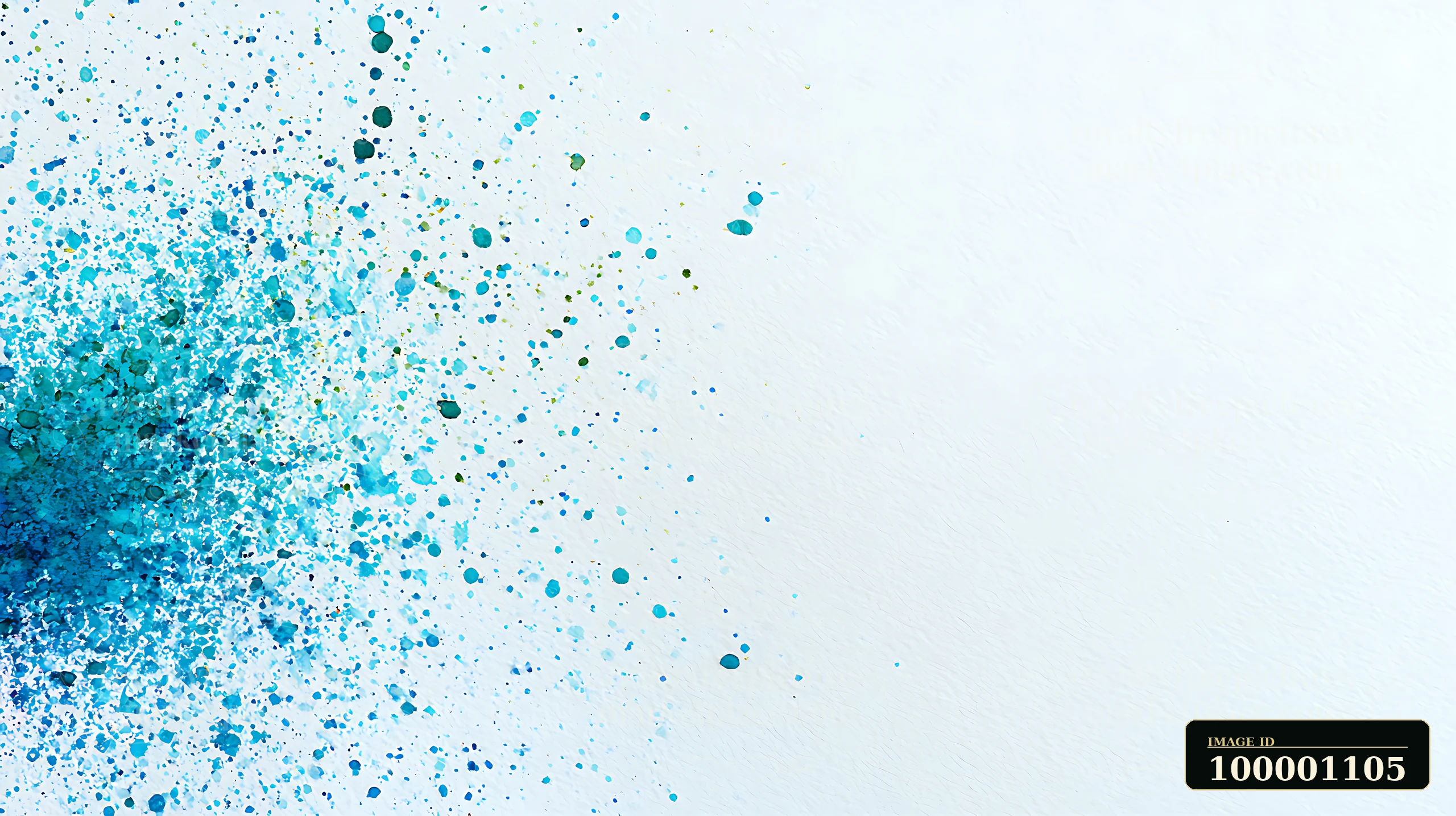 Blue paint splashes scatter across a white surface, forming an abstract pattern.
