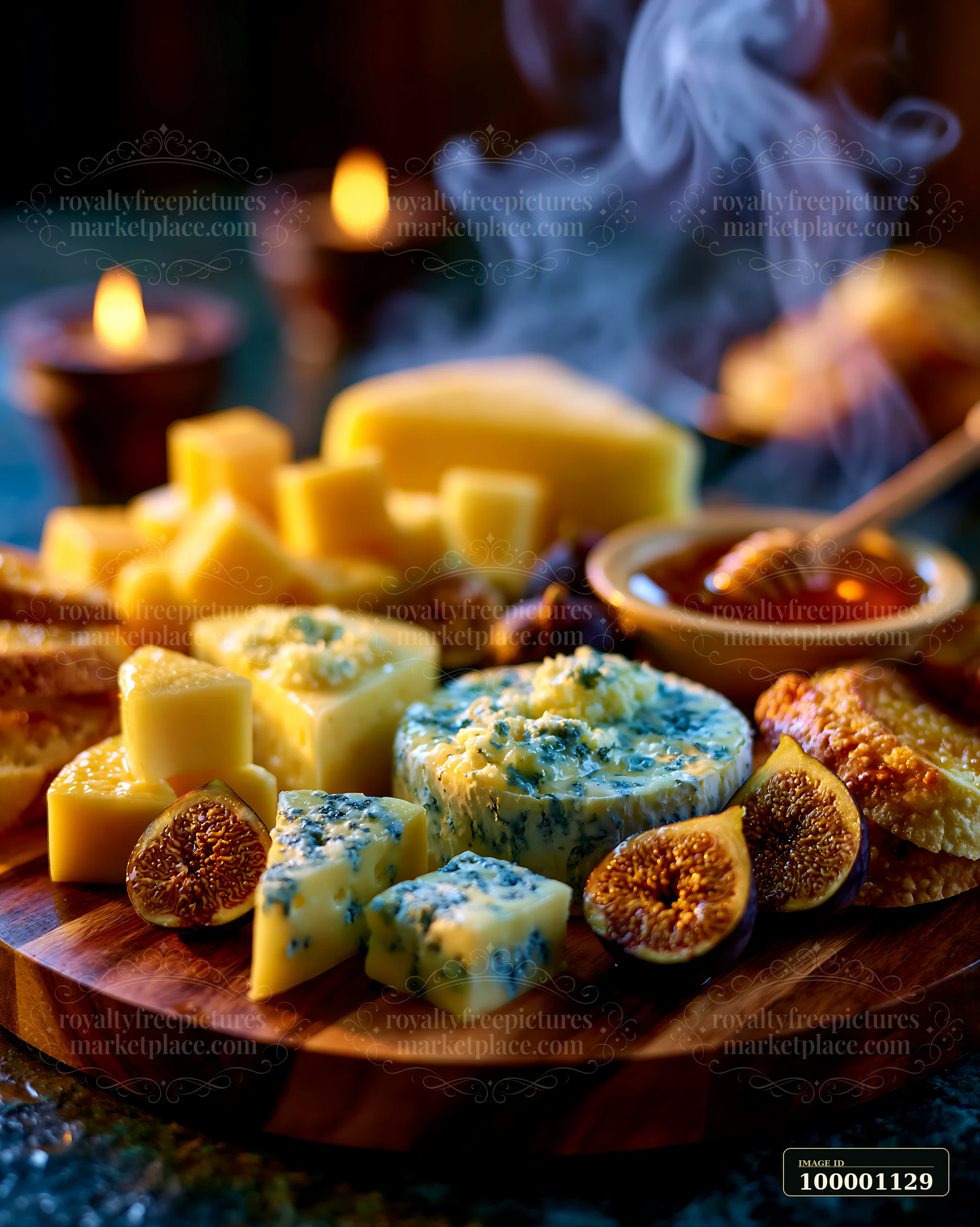 A wooden board displays various cheeses alongside dried figs and a small bowl of honey.