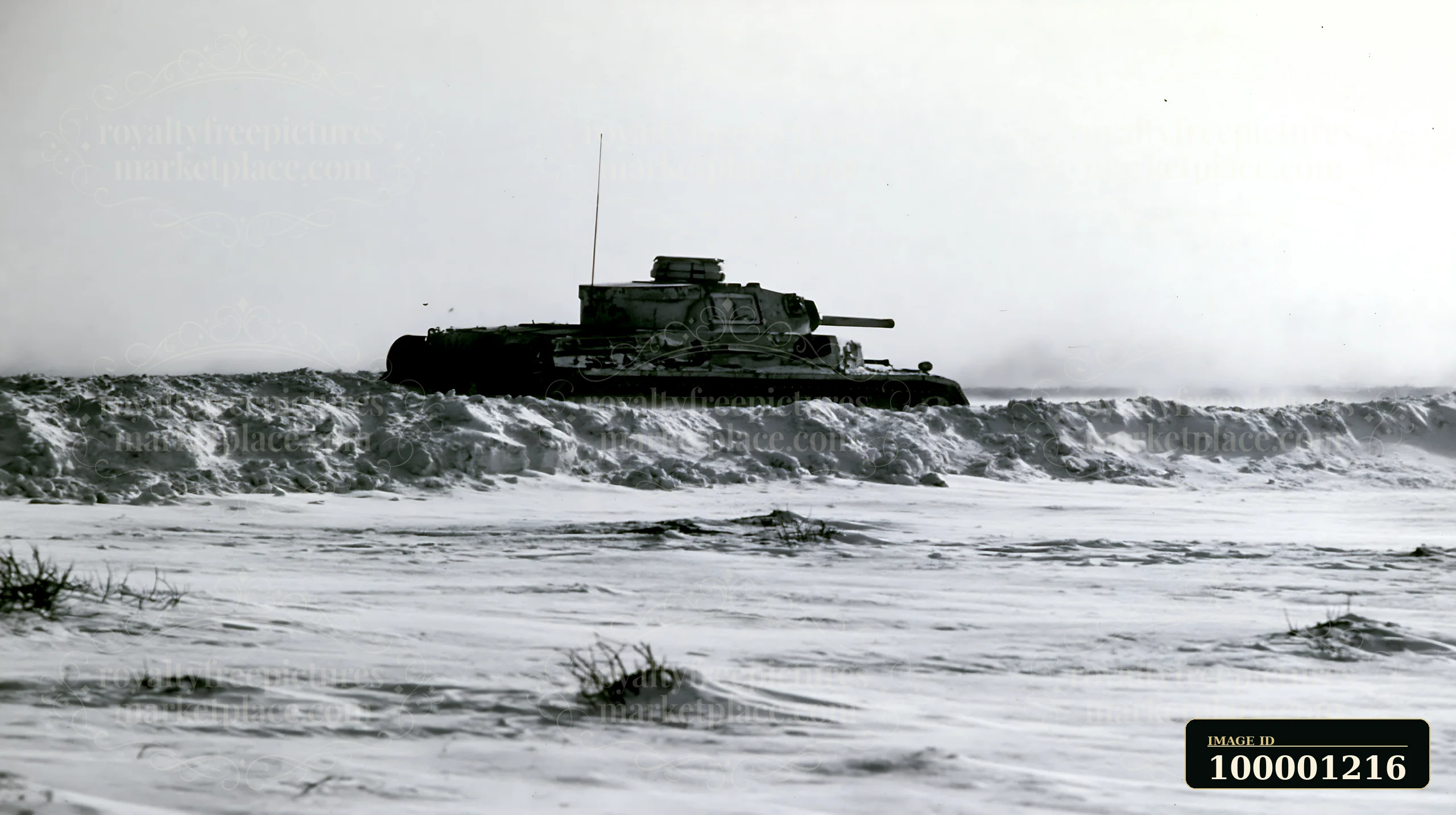 A panzer tank moves through deep snow, showcasing its heavy body against a stark winter landscape.