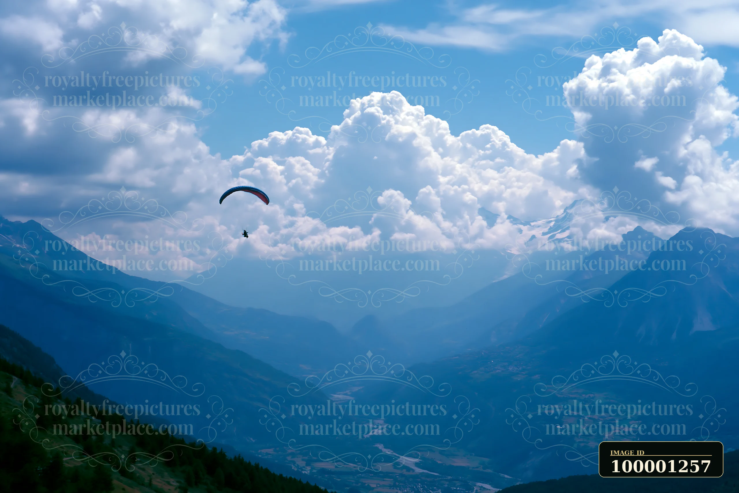 A paraglider glides through the sky amid dramatic clouds around alpine peaks.