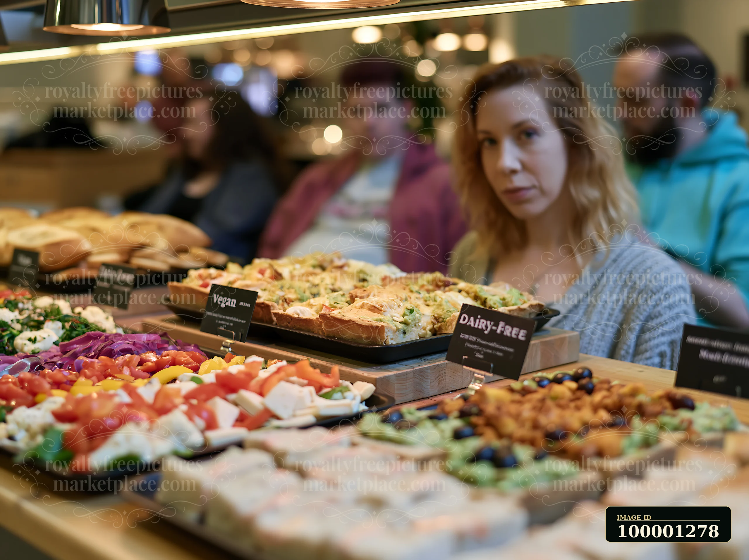 A buffet with dietary labels presents various food options in a dining area.
