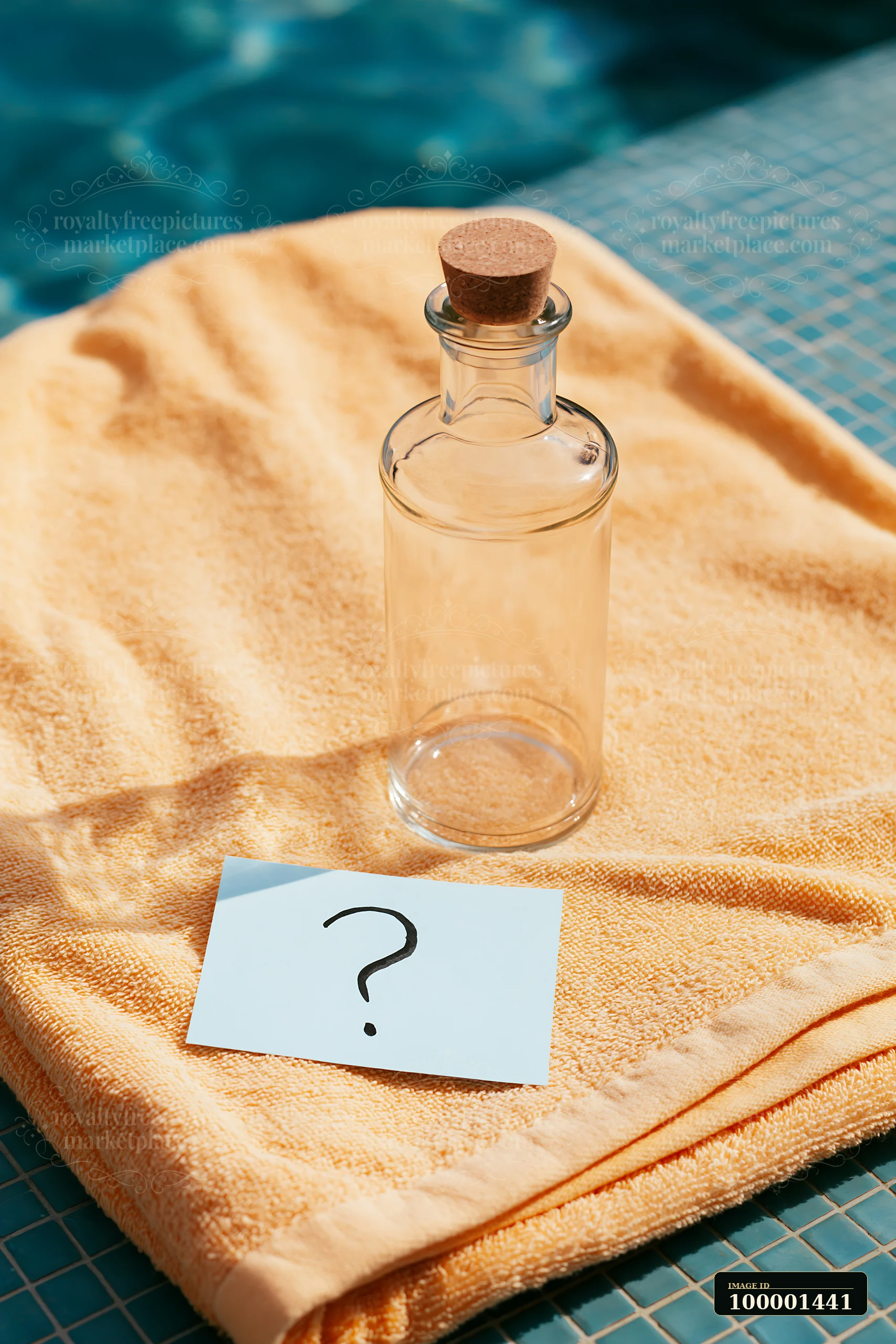An empty bottle stands on a yellow towel next to a pool, accompanied by a note with a question mark.