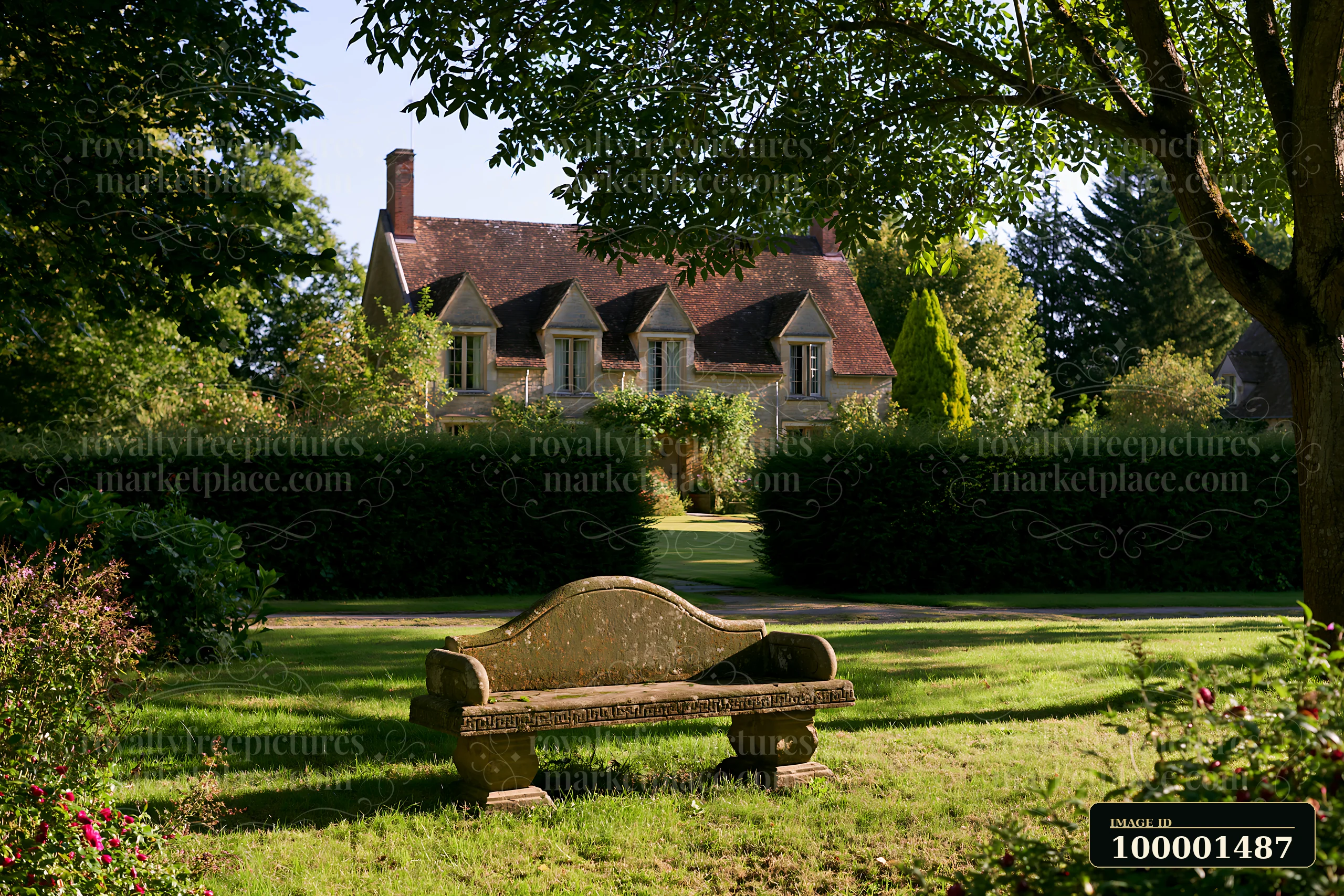 A country house surrounded by hedges sits in a lush garden with a stone bench in the foreground.