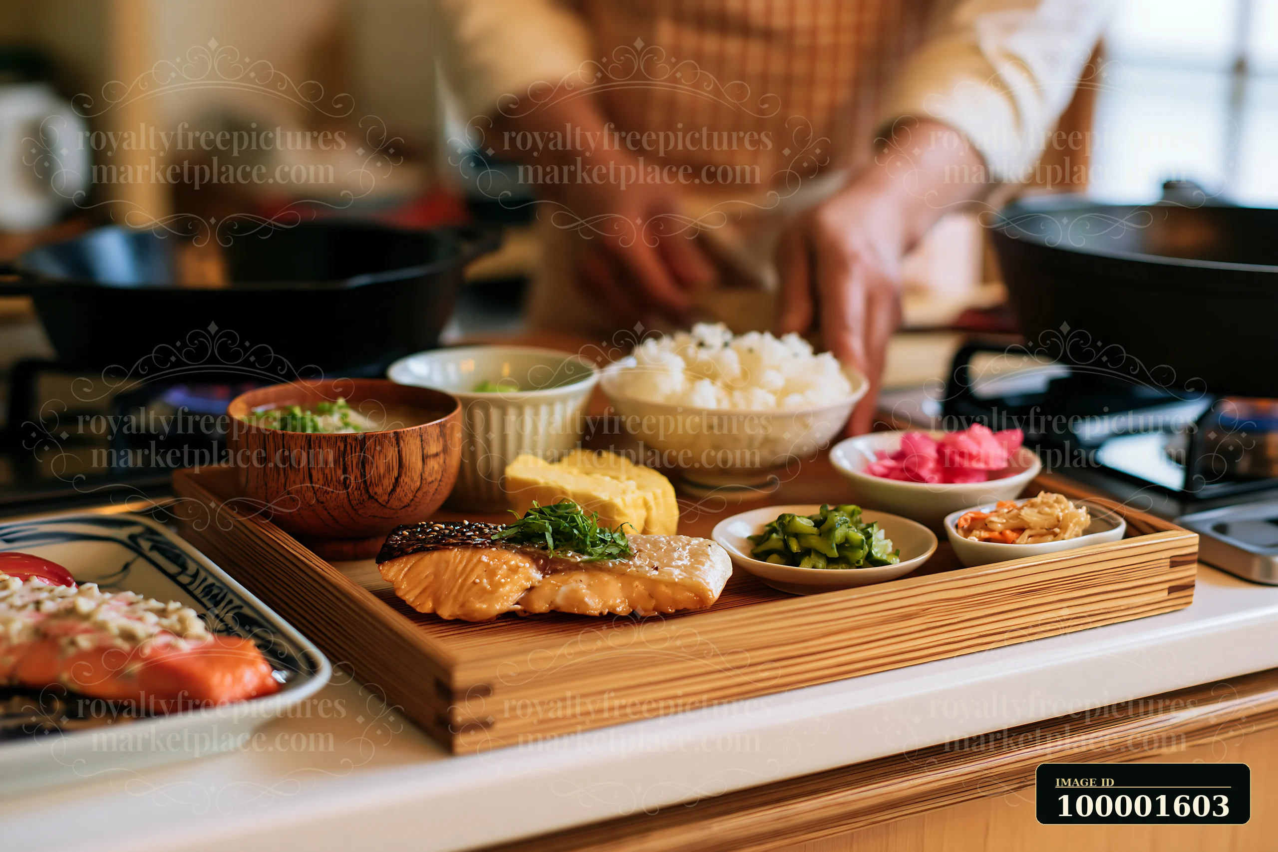A chef prepares traditional sushi breakfast in Japan, arranging fish, rice, and side dishes on a wooden tray in a kitchen setting.