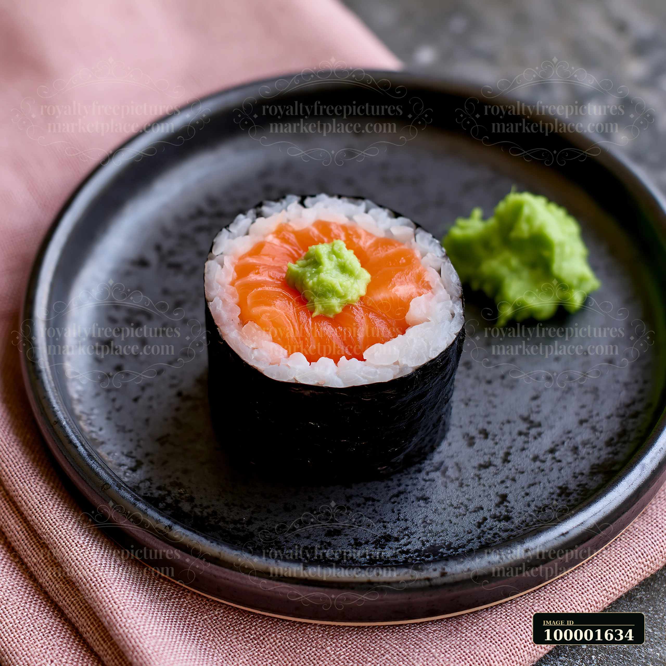 One salmon maki piece with wasabi rests on a dark plate, surrounded by simple textures.