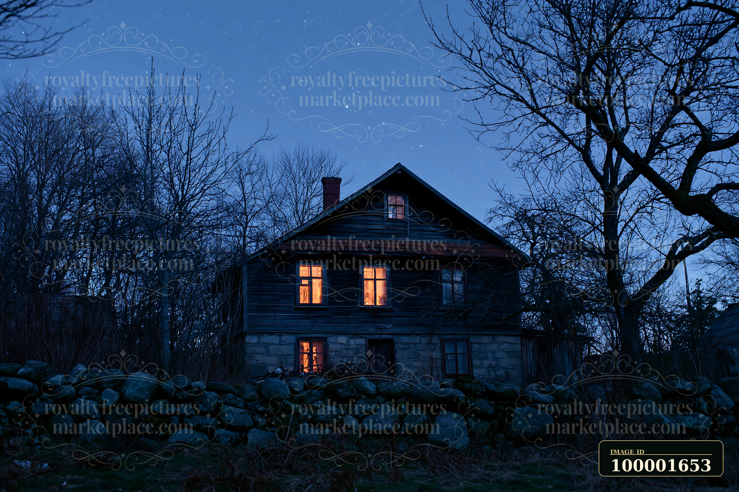 A country house stands under a clear starry sky, with warm light shining from its windows.