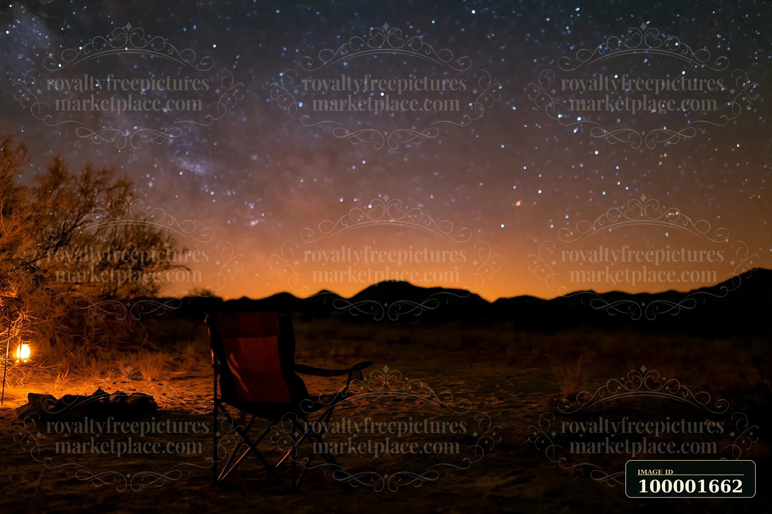 A camp chair sits under a starry night above a desert campsite.