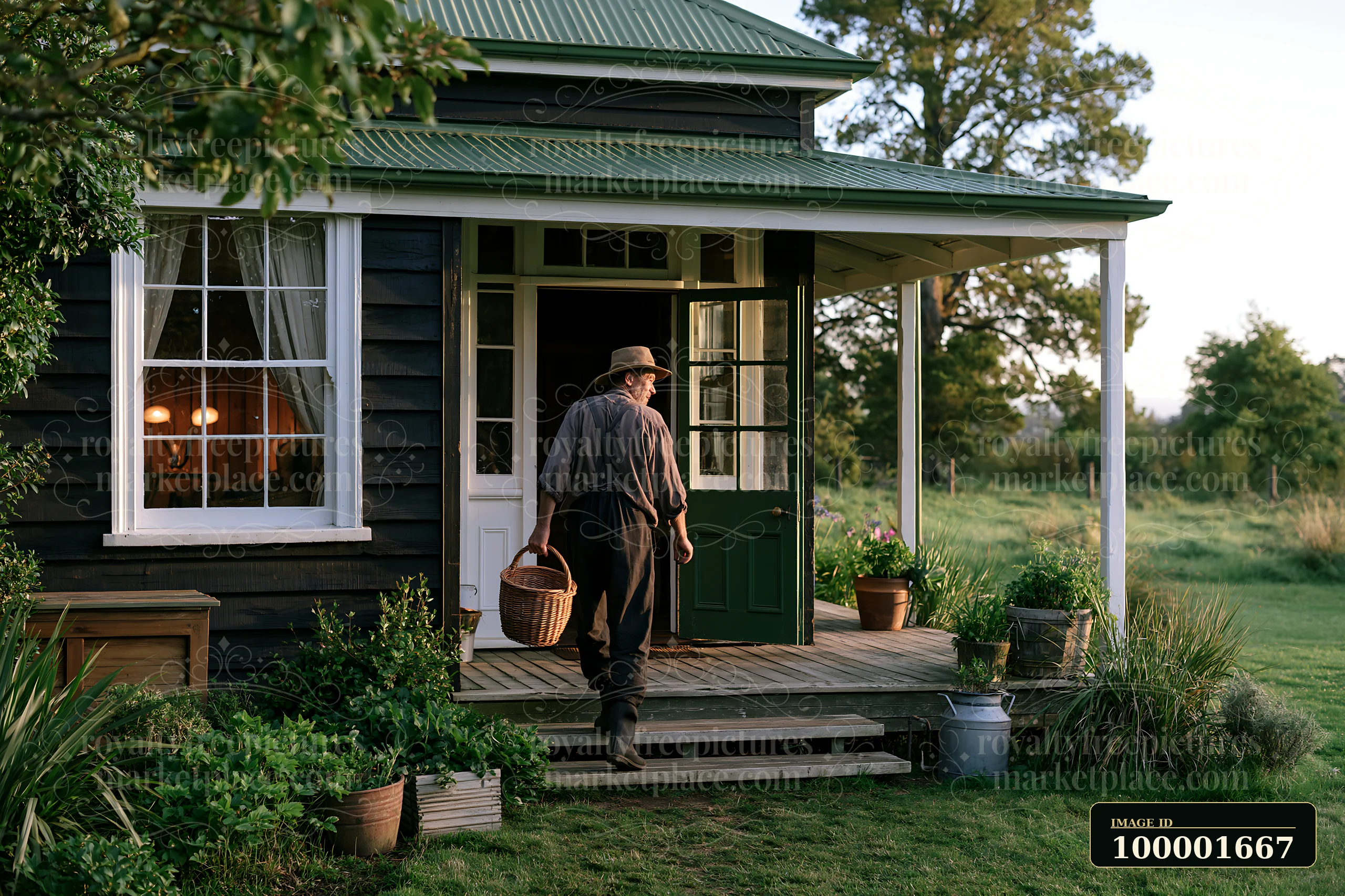 A person walks out of a country house with an open front door, holding a basket.