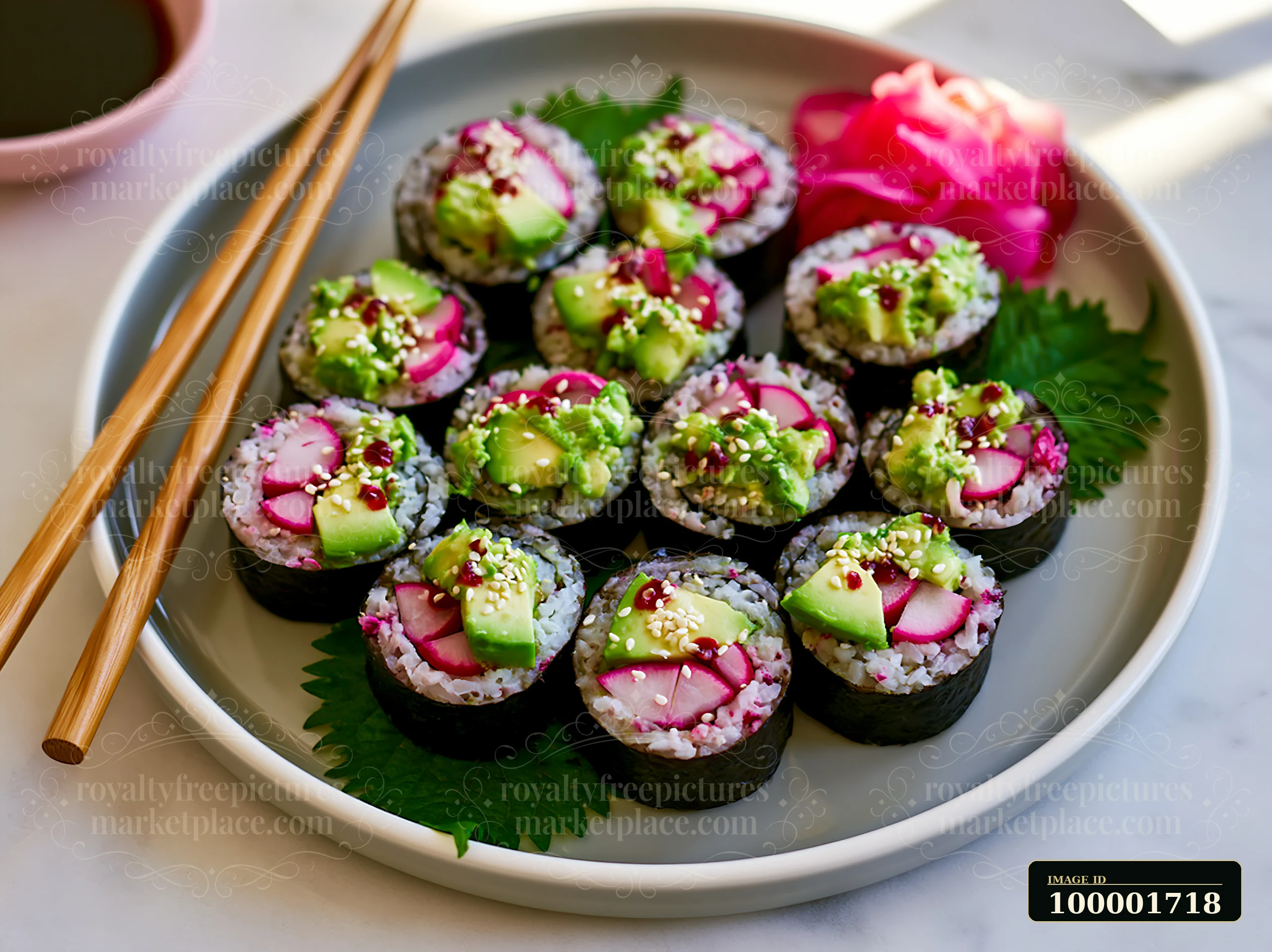 Sushi rolls with shiso leaves display various colorful toppings, including avocado and radish, arranged on a round plate.
