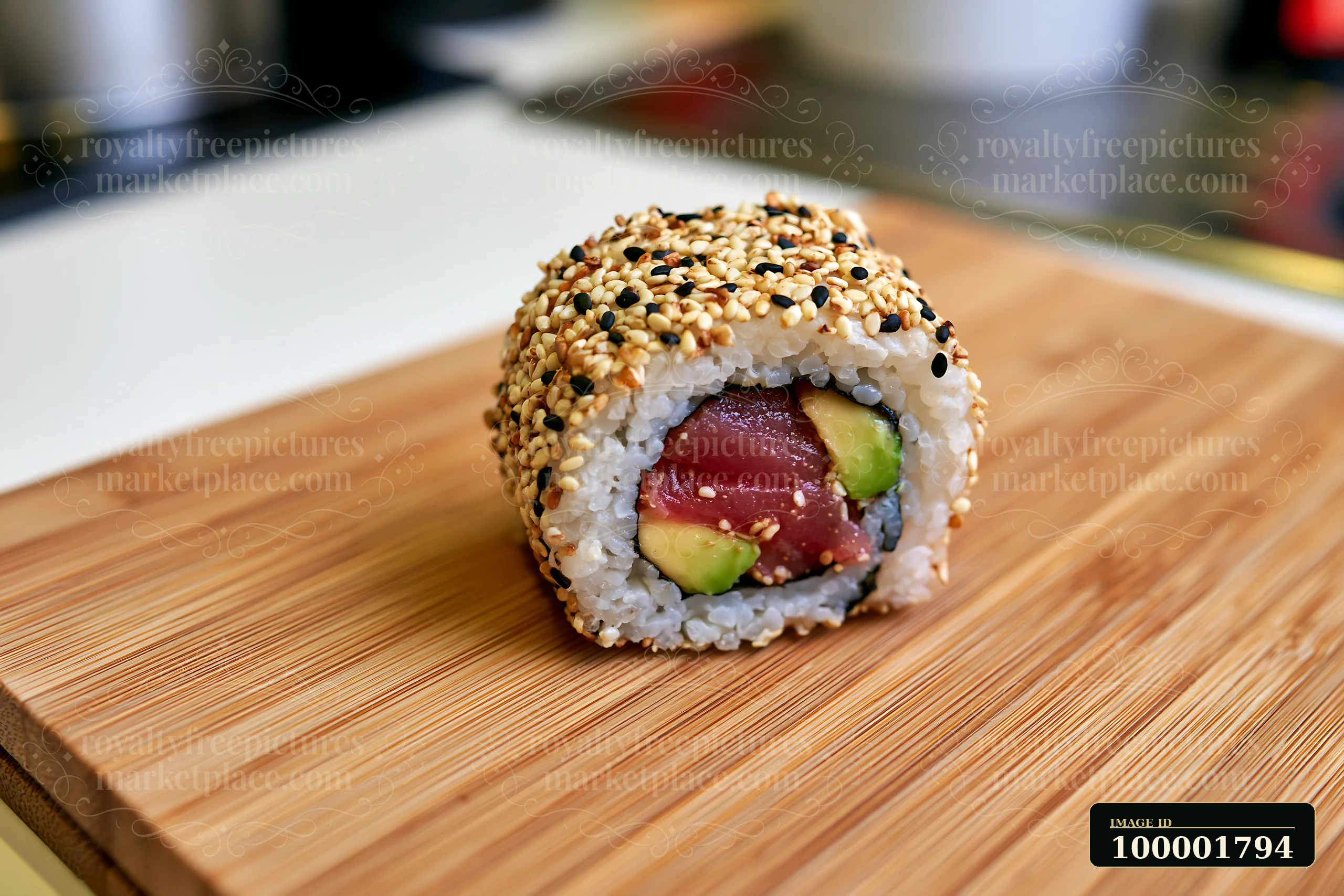 This sushi features one tuna roll slice with sesame coating, showcasing layers of rice, tuna, and avocado.