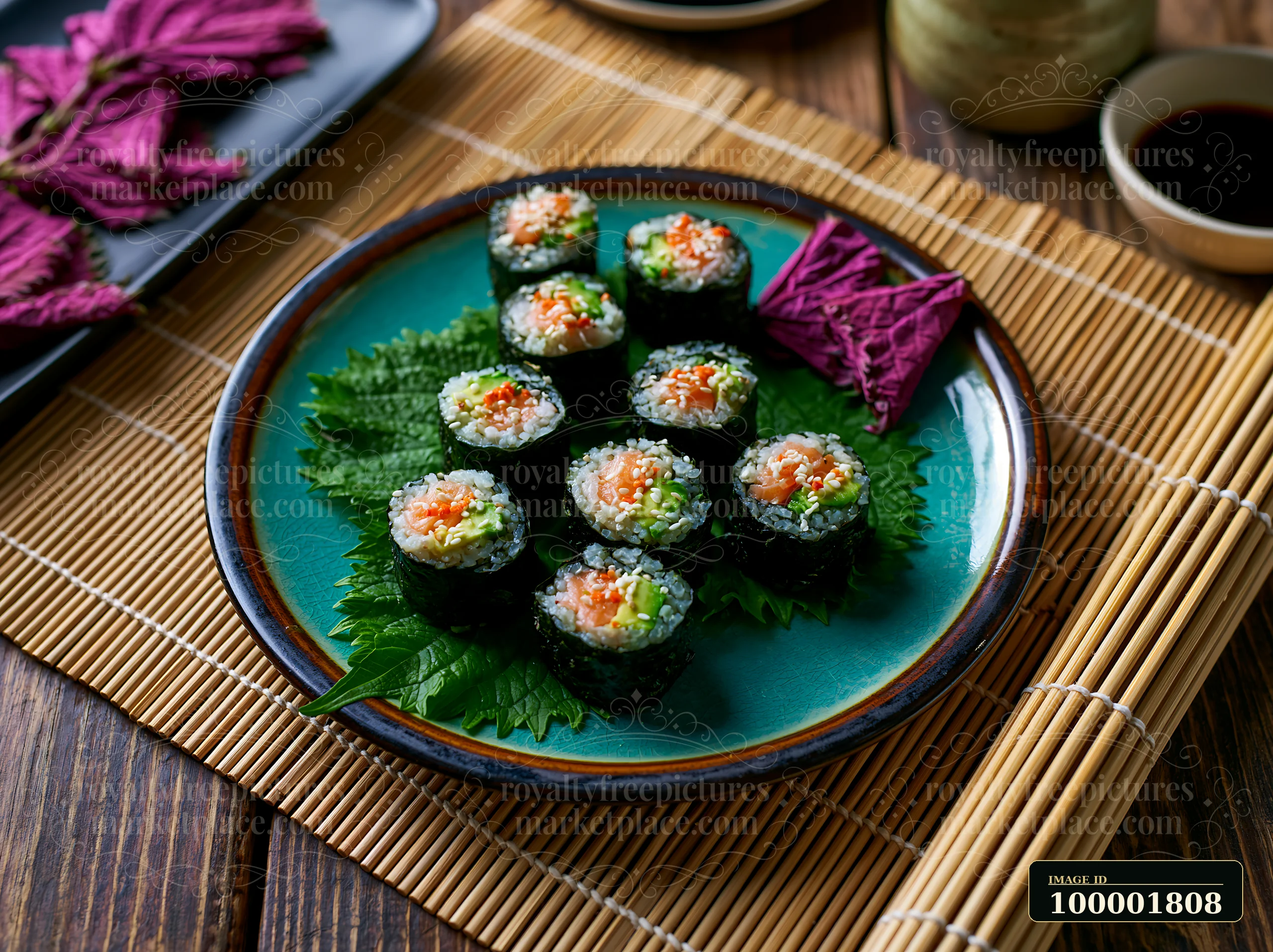 Sushi with shiso leaves is arranged on a blue plate.