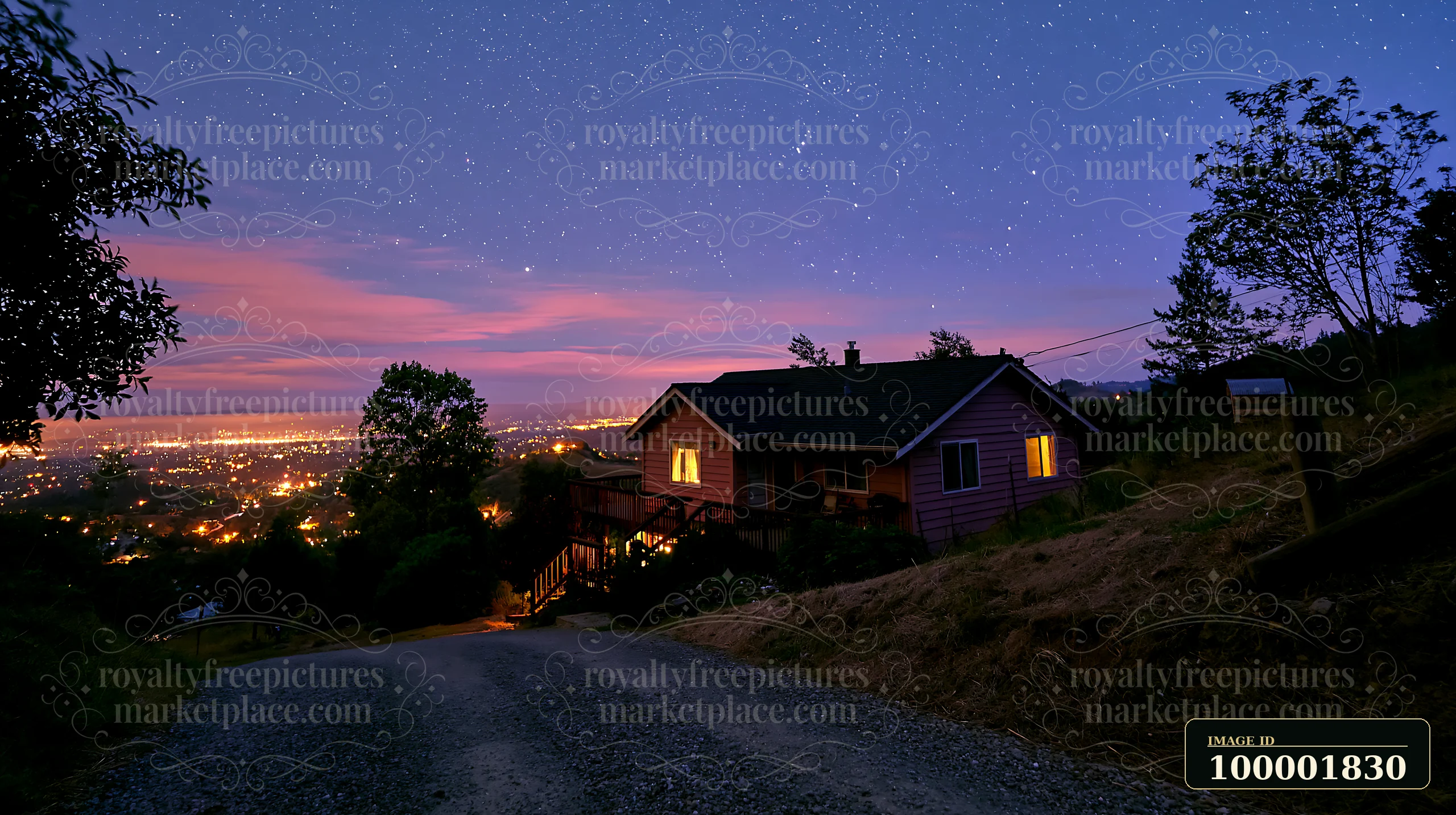A house sits under a starry sky with lights shining from its windows.