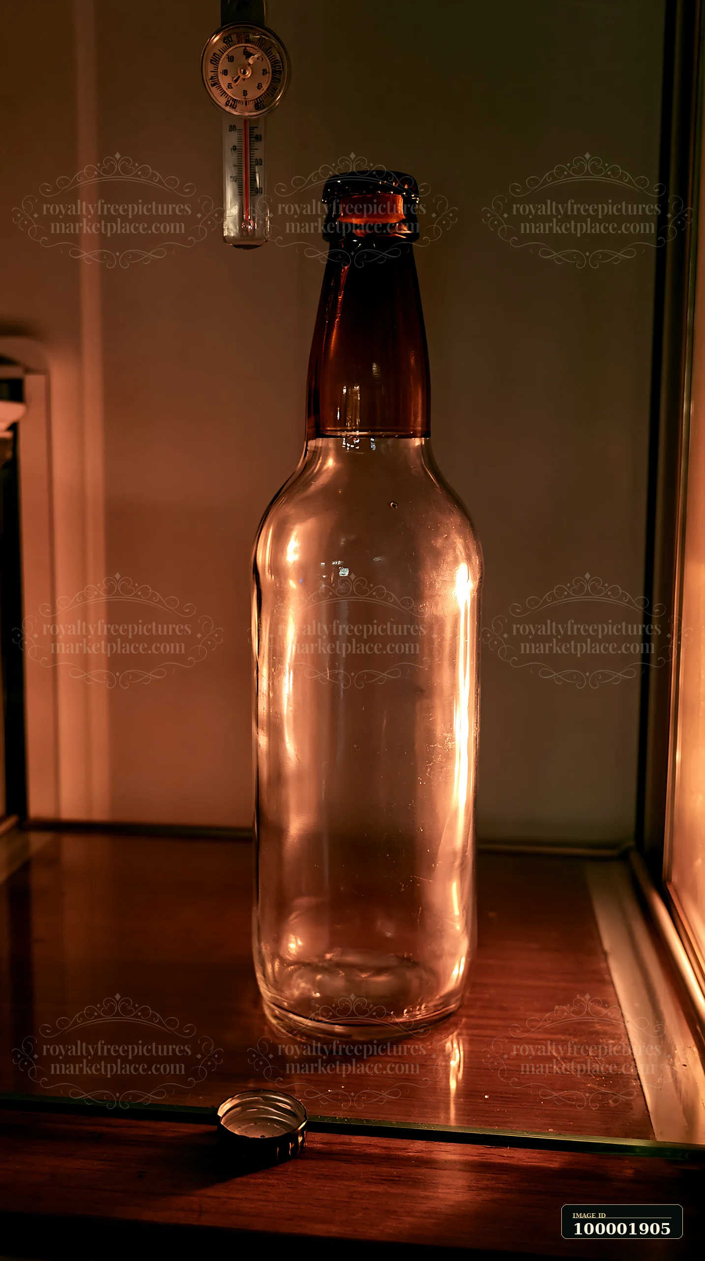 An empty bottle is placed on a wooden shelf inside a refrigerator.