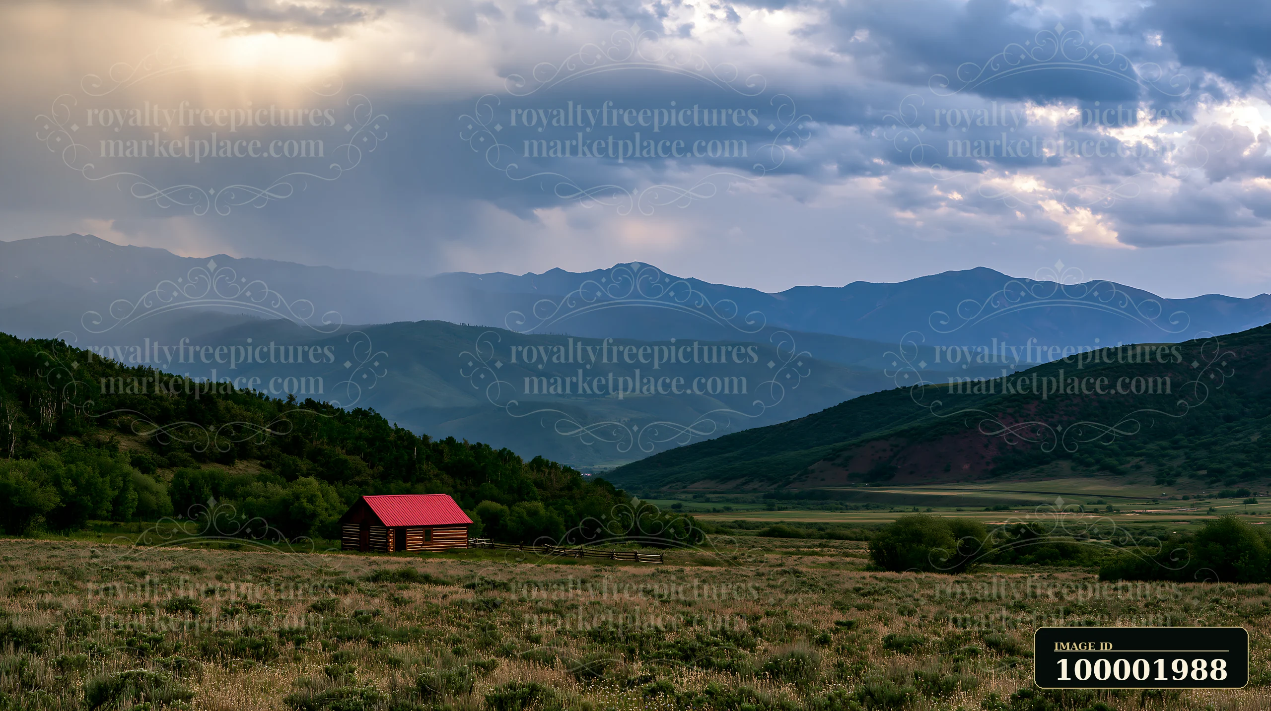 A cabin sits in the foreground as dark thunderstorm clouds gather over a mountain range in the background.