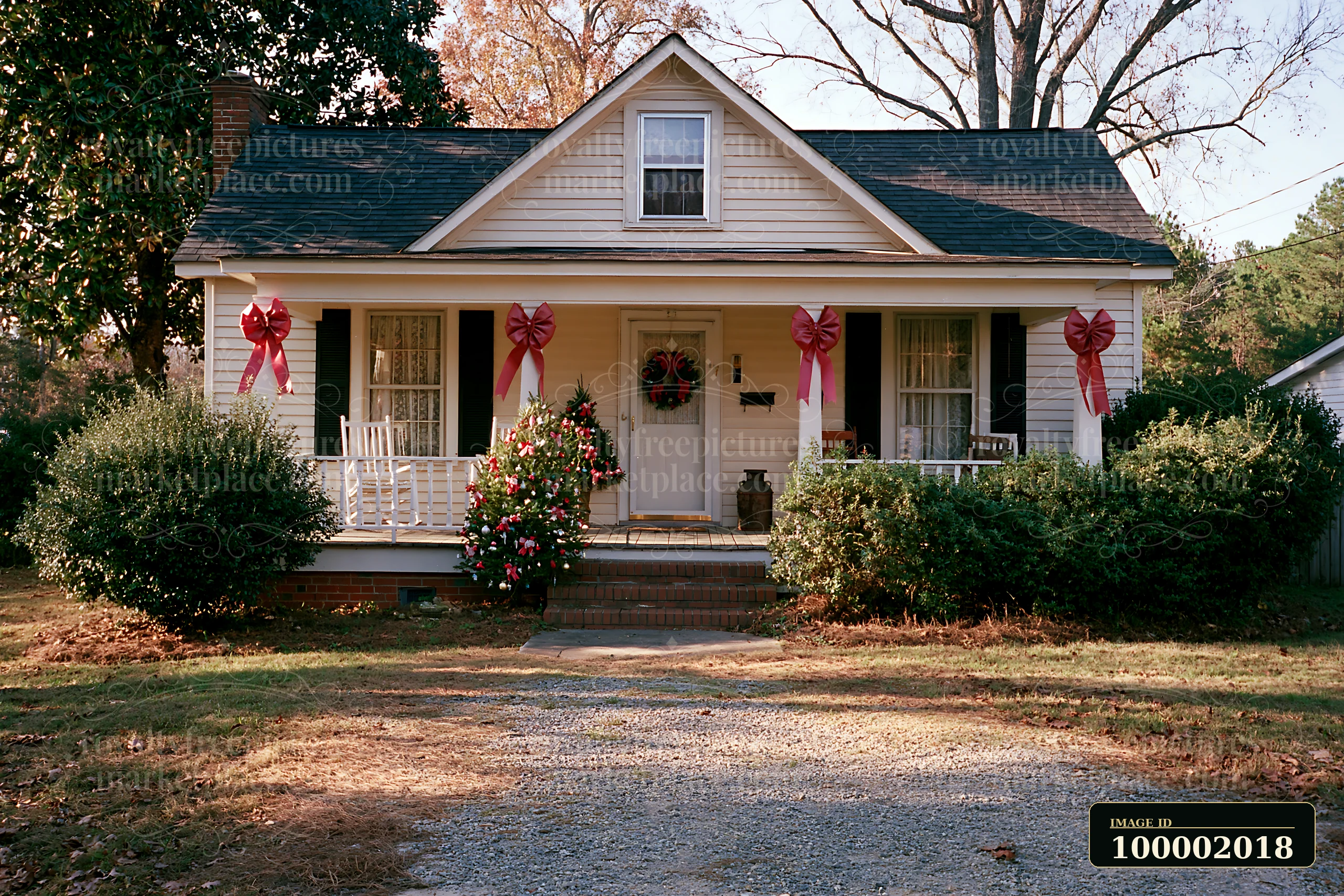 A country cottage with Christmas decorations shows a warm holiday spirit.