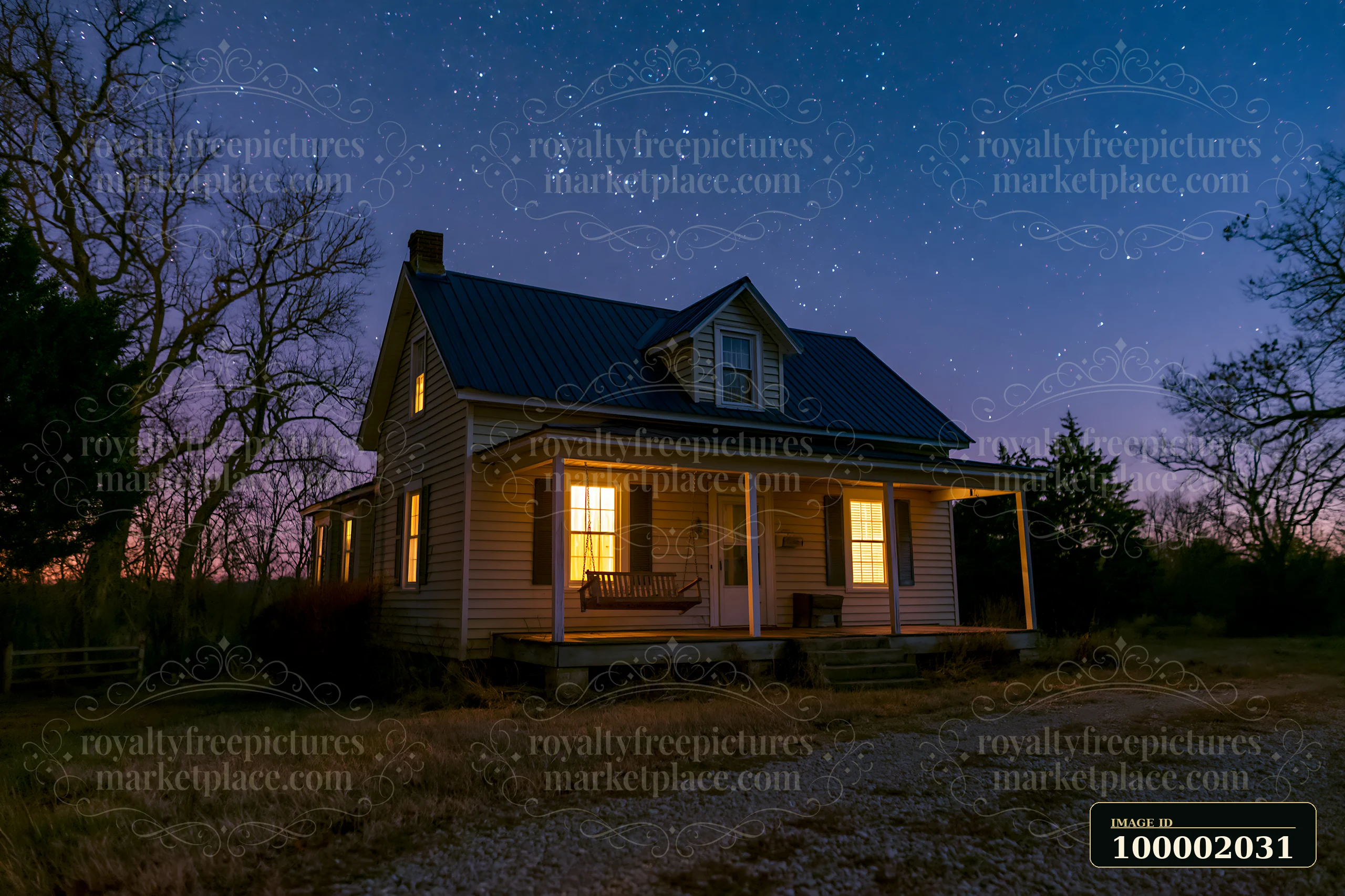 A house with a porch swing stands under a starry sky.