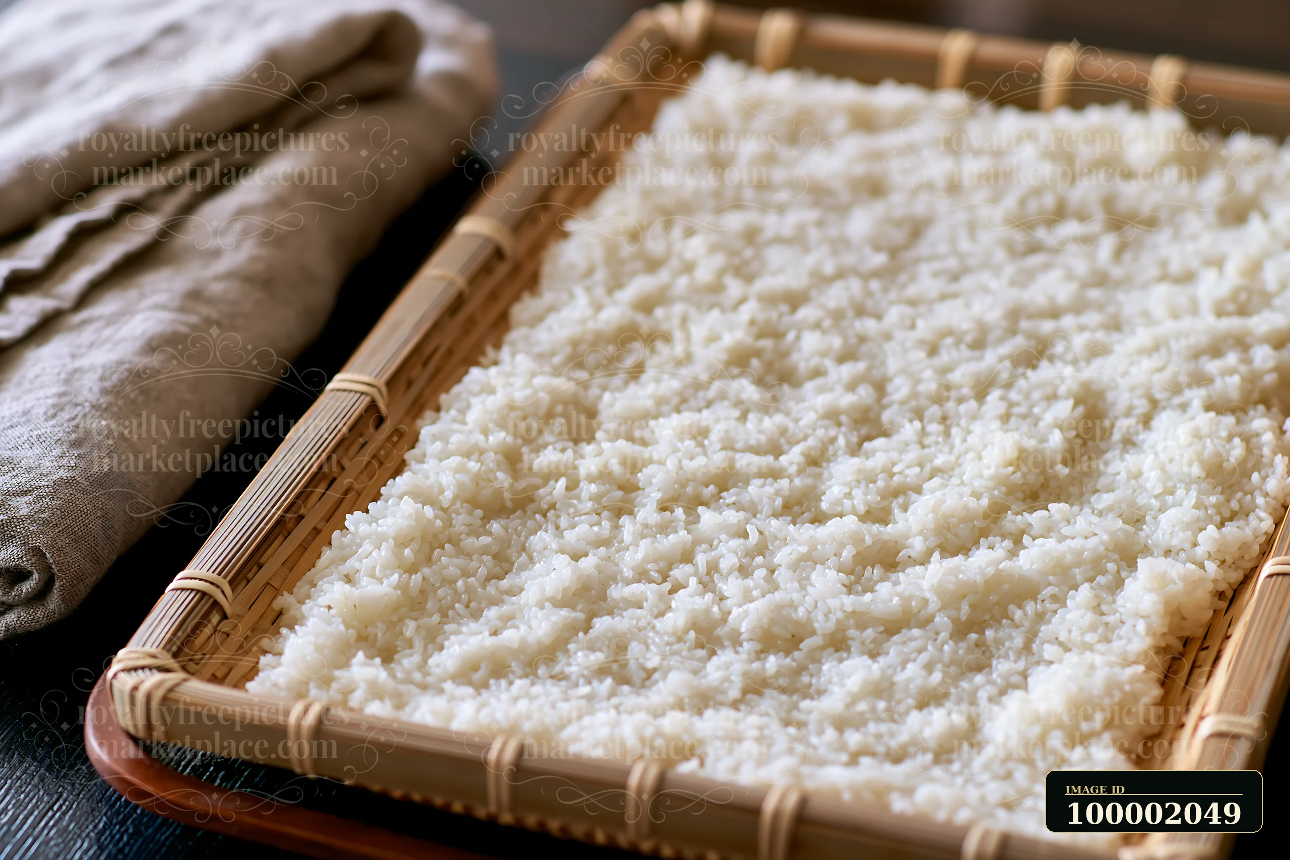 Sushi rice cooling on tray allows for the proper preparation of sushi.