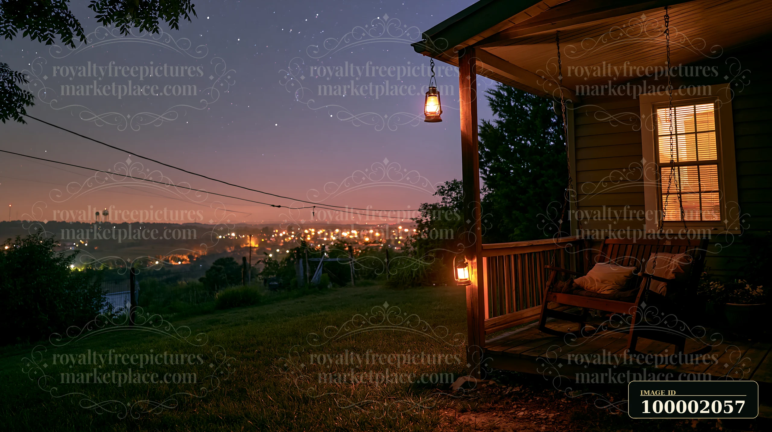 A house with a porch swing sits in a quiet area under a starry sky.