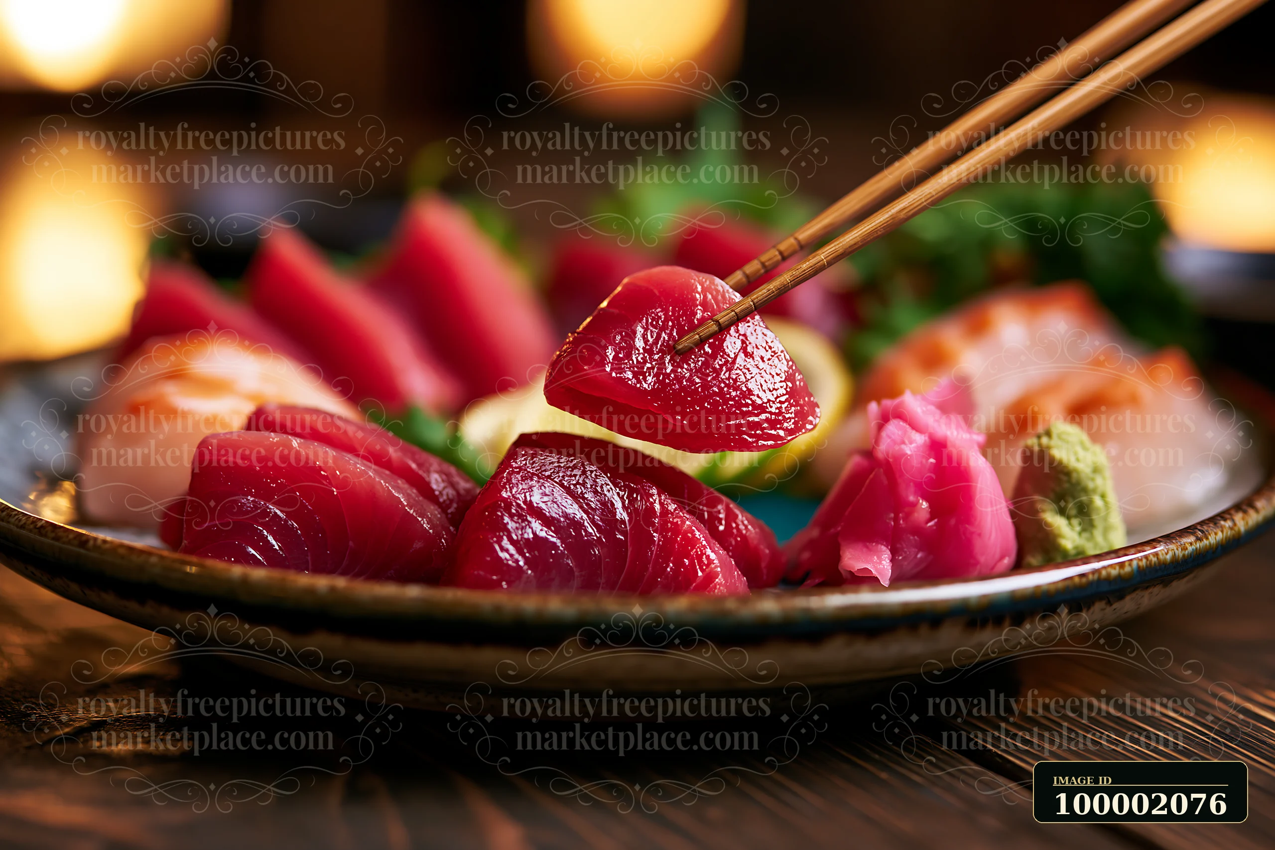 Sashimi platter with pickled ginger and wasabi placed on a dark wooden table.