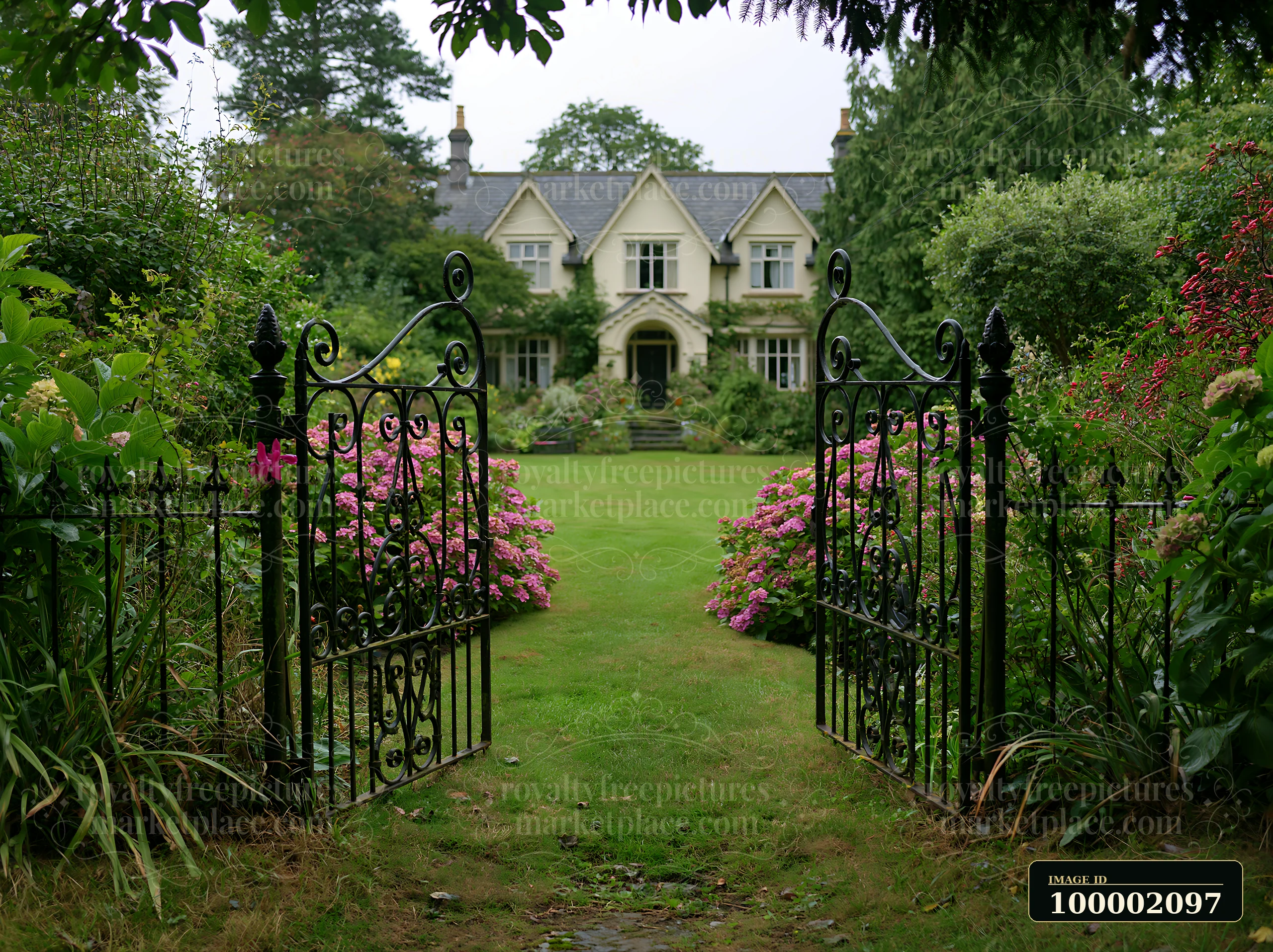 A traditional country house exterior is framed by a wrought iron gate and colorful flowers.