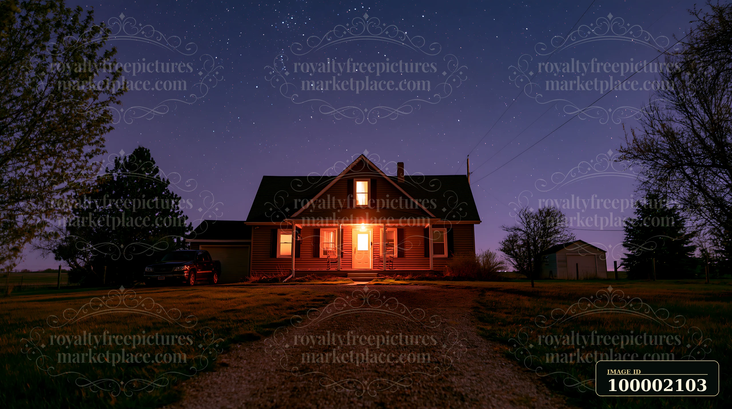 A house stands under a starry sky, with a gravel driveway leading to its entrance.