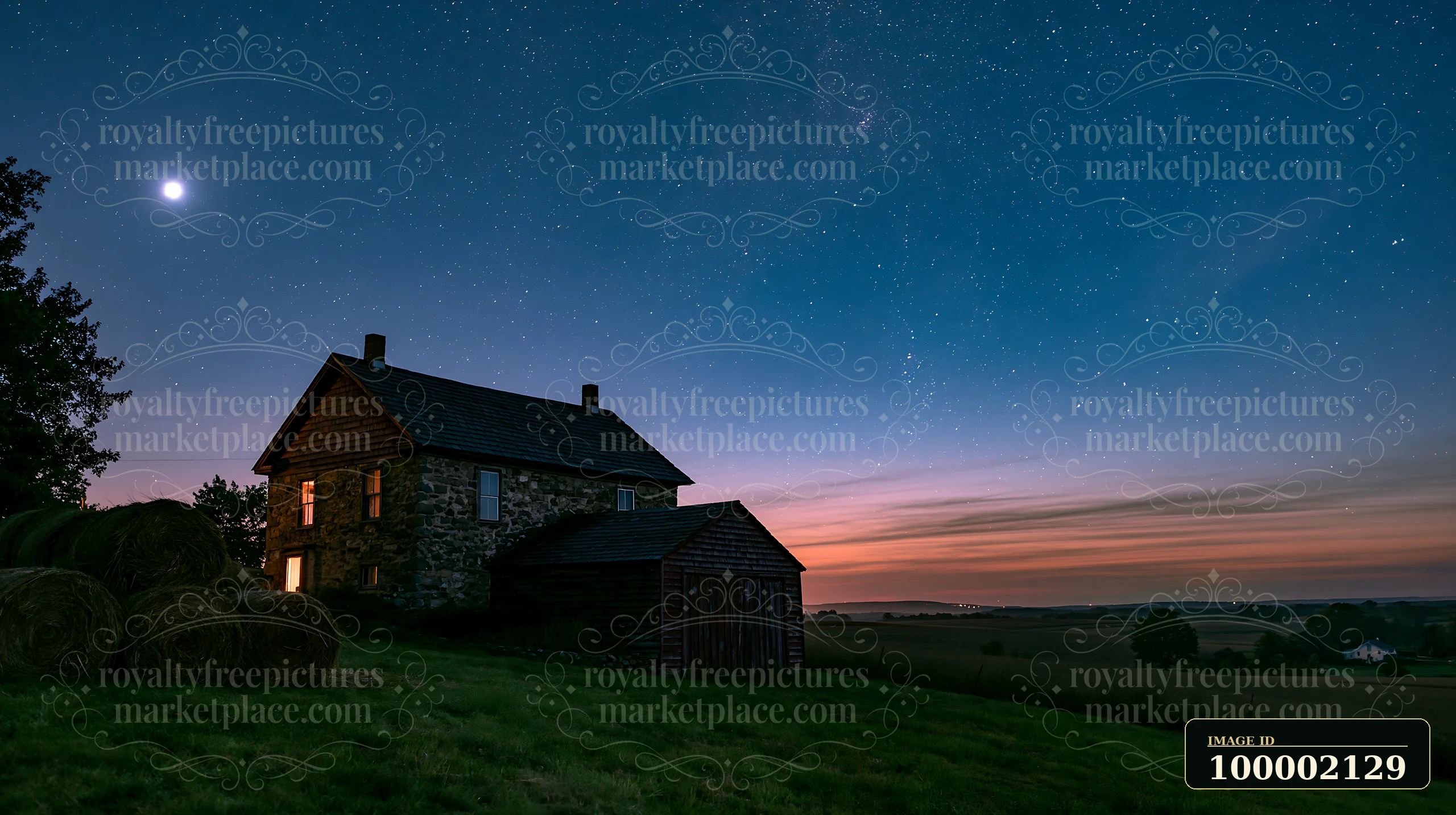 A farmhouse beneath night sky shows a clear view of stars and moon.