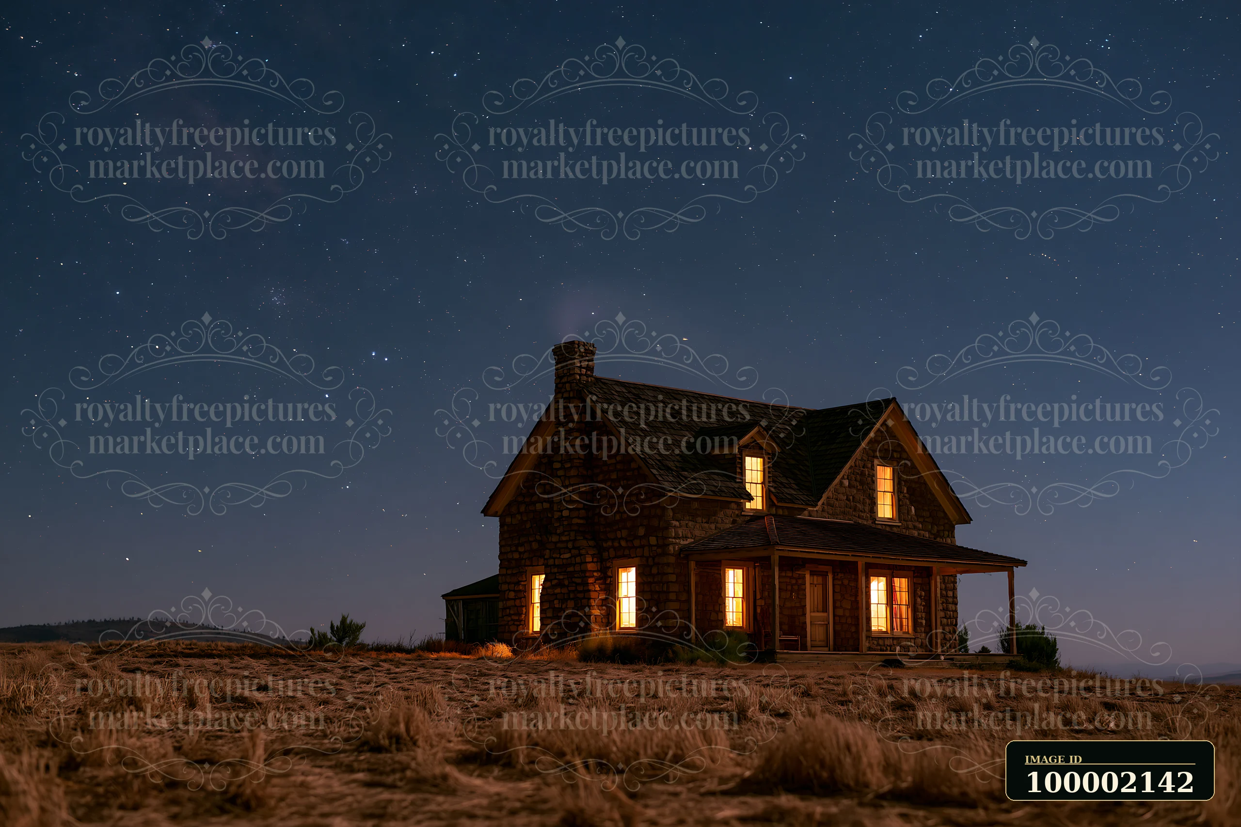 A country house under starry sky stands in an open field, with warm light shining through its windows.