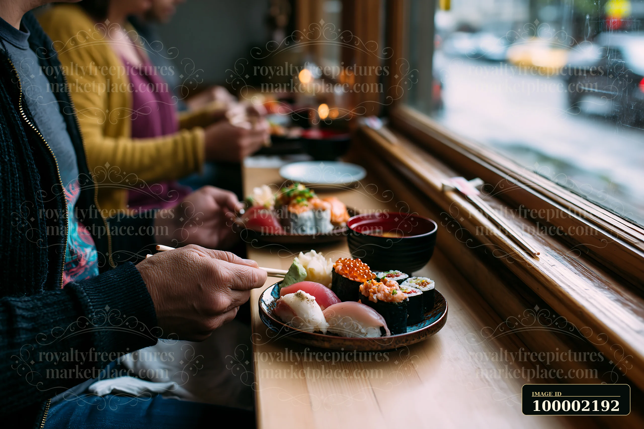 Two people enjoy a romantic sushi dinner at a cozy restaurant, seated at a wooden table by the window.