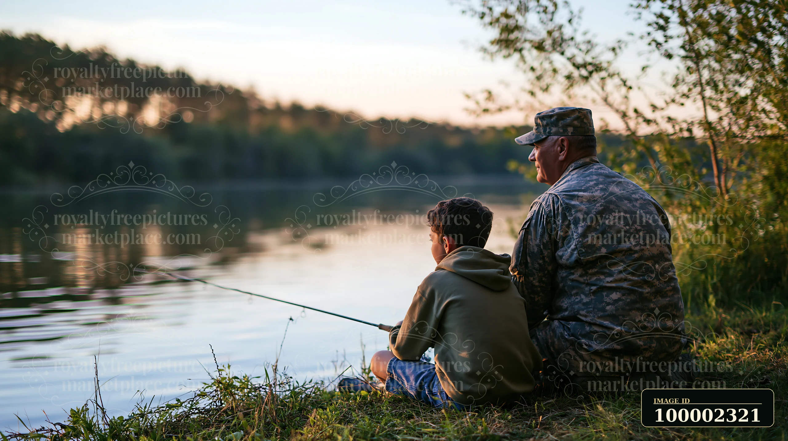 A retired soldier shares a fishing experience with his grandson by the tranquil lake at sunset.